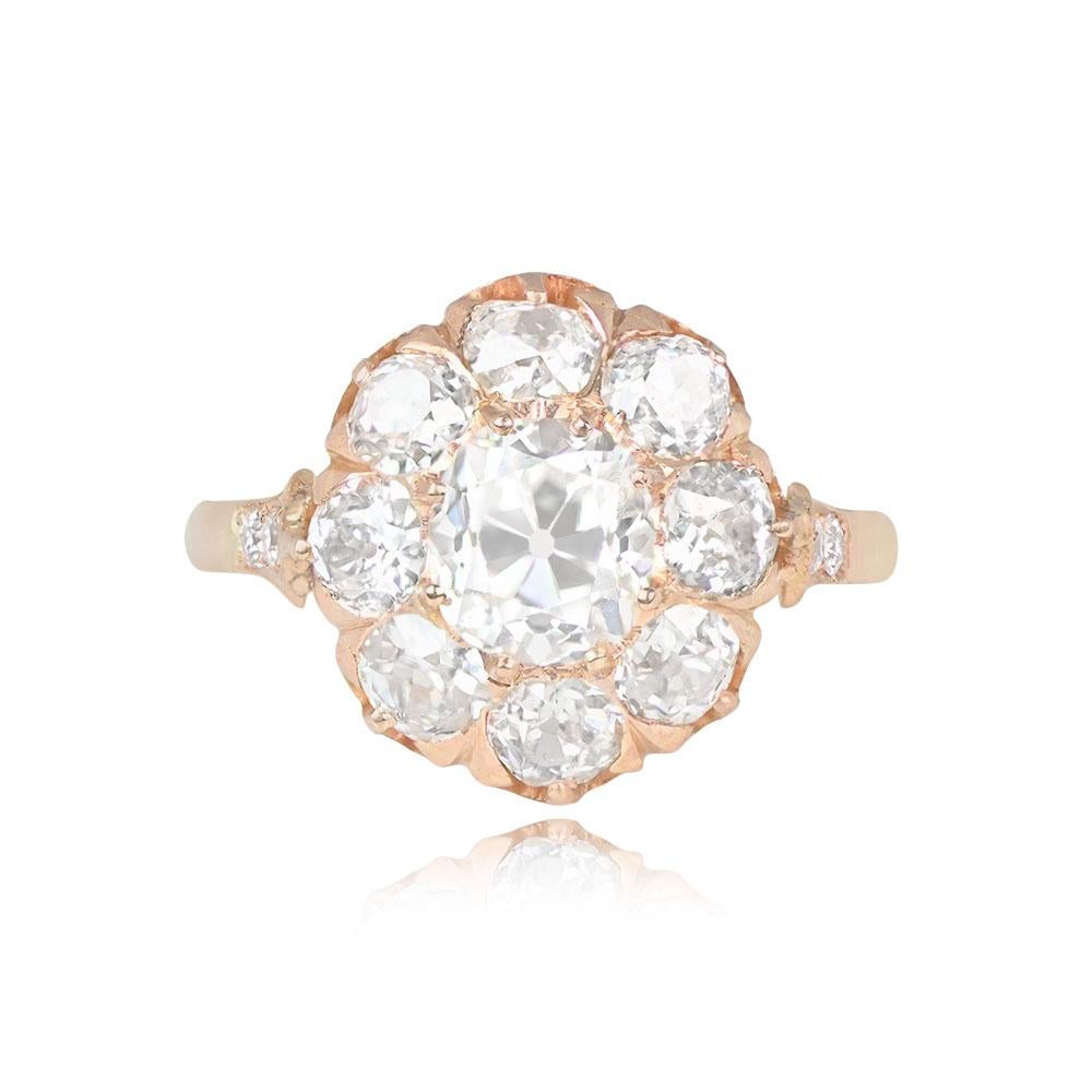 This antique Victorian diamond cluster engagement ring highlights a prong-set 1.02-carat antique cushion-cut center diamond with I color and VS1 clarity. The floral motif cluster is surrounded by old mine cut diamonds in H-I color and with VS2