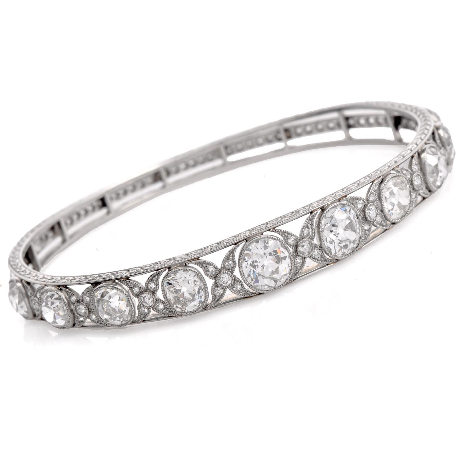 This exquisite Antique Old European Diamond Bangle Bracelet, circa 1900  showcases a captivating openwork design.

Crafted in platinum, it features a stunning array of old mine, old European-cut diamonds. These high-color and clarity natural