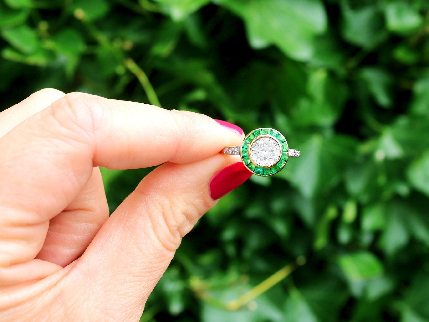 A stunning antique 1930s 1.05 Carat emerald and 1.18 Carat diamond, 18 karat yellow and platinum dress ring; part of our diverse antique jewelry and estate jewelry collections.

This stunning, fine and impressive antique emerald ring has been