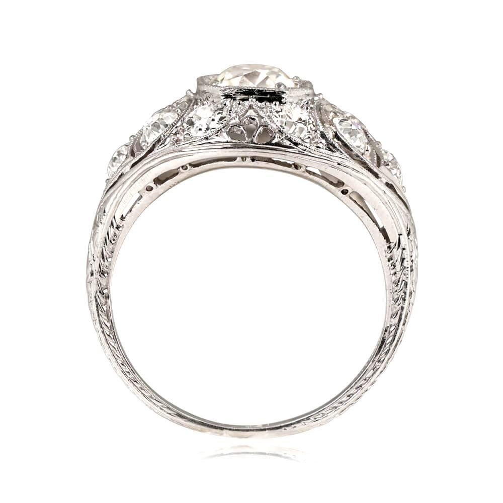 Experience the elegance of an Edwardian engagement ring, boasting a cluster of antique diamonds set in a stunning dome-shaped platinum mounting. The center diamond is a mesmerizing antique cushion cut, weighing 1.08 carats and shimmering with an I
