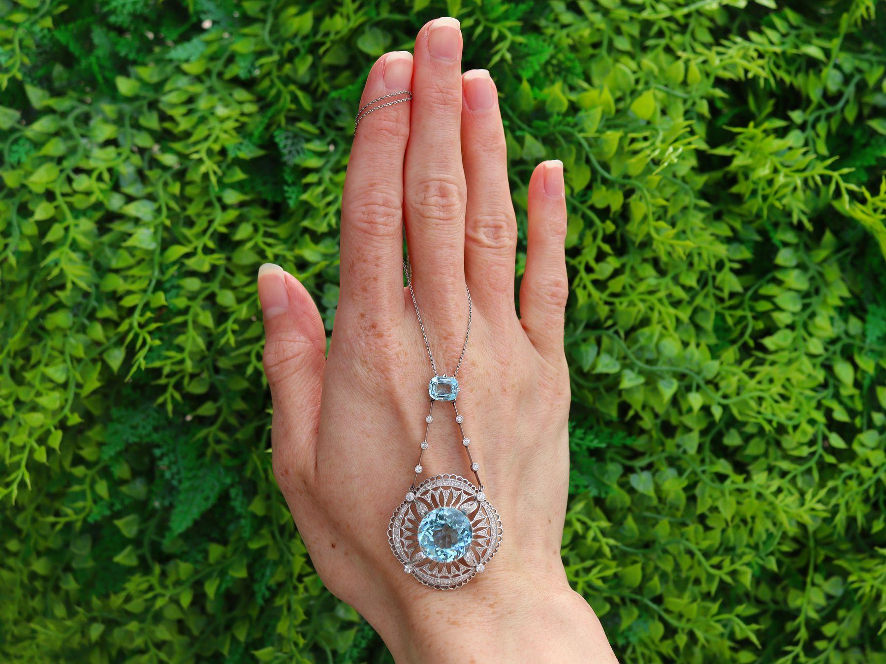 A stunning antique 10.97 carat aquamarine and 1.57 carat topaz, 1.42 carat diamond and platinum necklace; part of our diverse antique jewelry and estate jewelry collections.

This stunning, fine and impressive antique pendant has been crafted in