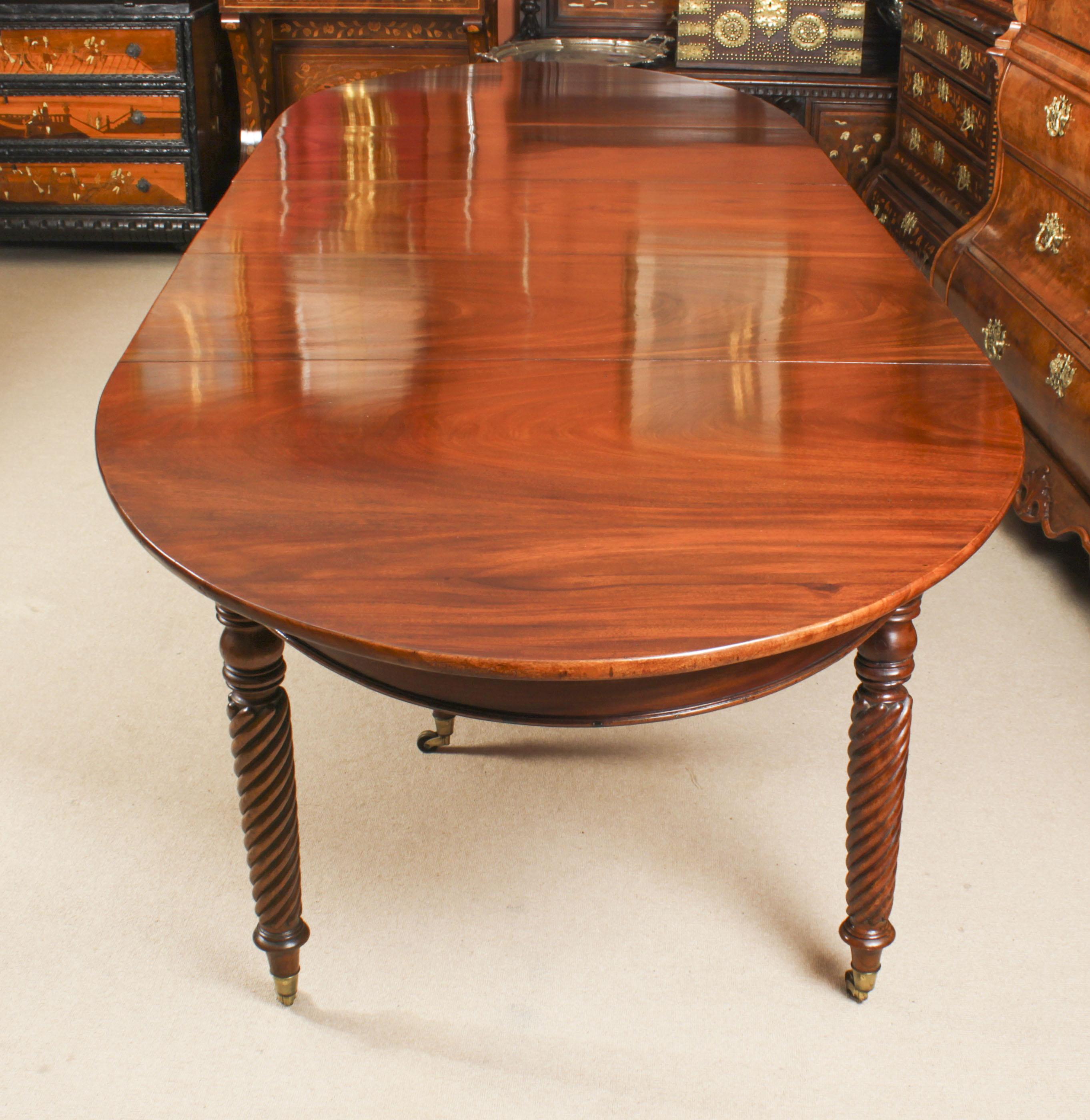 An extremely rare Regency Period Wilkinson Patent concertina action extending dining table in flame mahogany, Circa 1820 in date.

It has three original extension leaves and eight twist reeded legs all fitted with brass castors. This type of