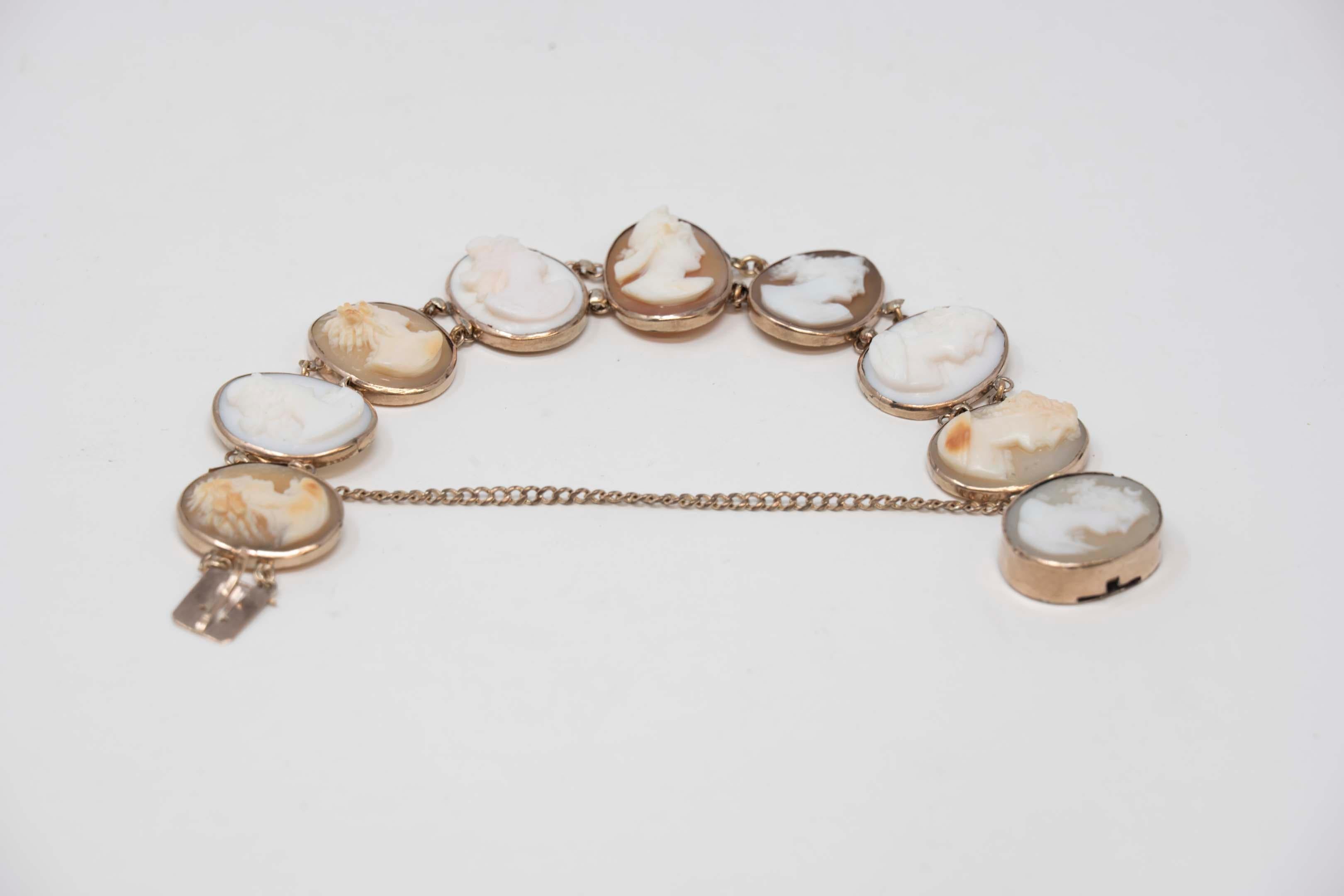 Antique 10k gold conch shell cameo bracelet circa 1890, unmarked, tested 10k gold. Measures 6 1/2 inches long, each carved figure measures 17mm x 13mm. The wear is consistent with age 14.8 grams.
