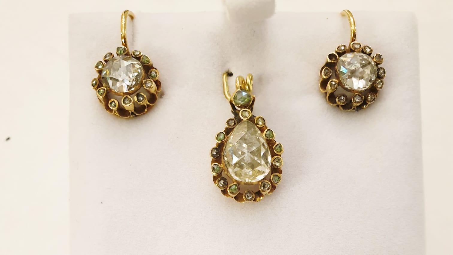 Antique rose cut diamond set of earrings and pendant in large stones earrings messurments 7mm diameter and pendant central diamond diameter is 9mm×7mm and 17mm pendant length in full facets excellent spark back foiled old technique and 10k gold