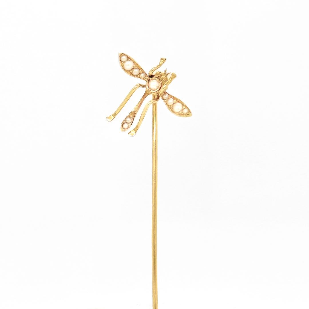 A fine antique figural stickpin.

In 10 karat yellow gold.

In the form of an insect with wings and legs outstretched (possibly a dragonfly or water skimmer).

Flush set with seed pearls throughout.

Simply a wonderful figural stickpin!

Date:
20th