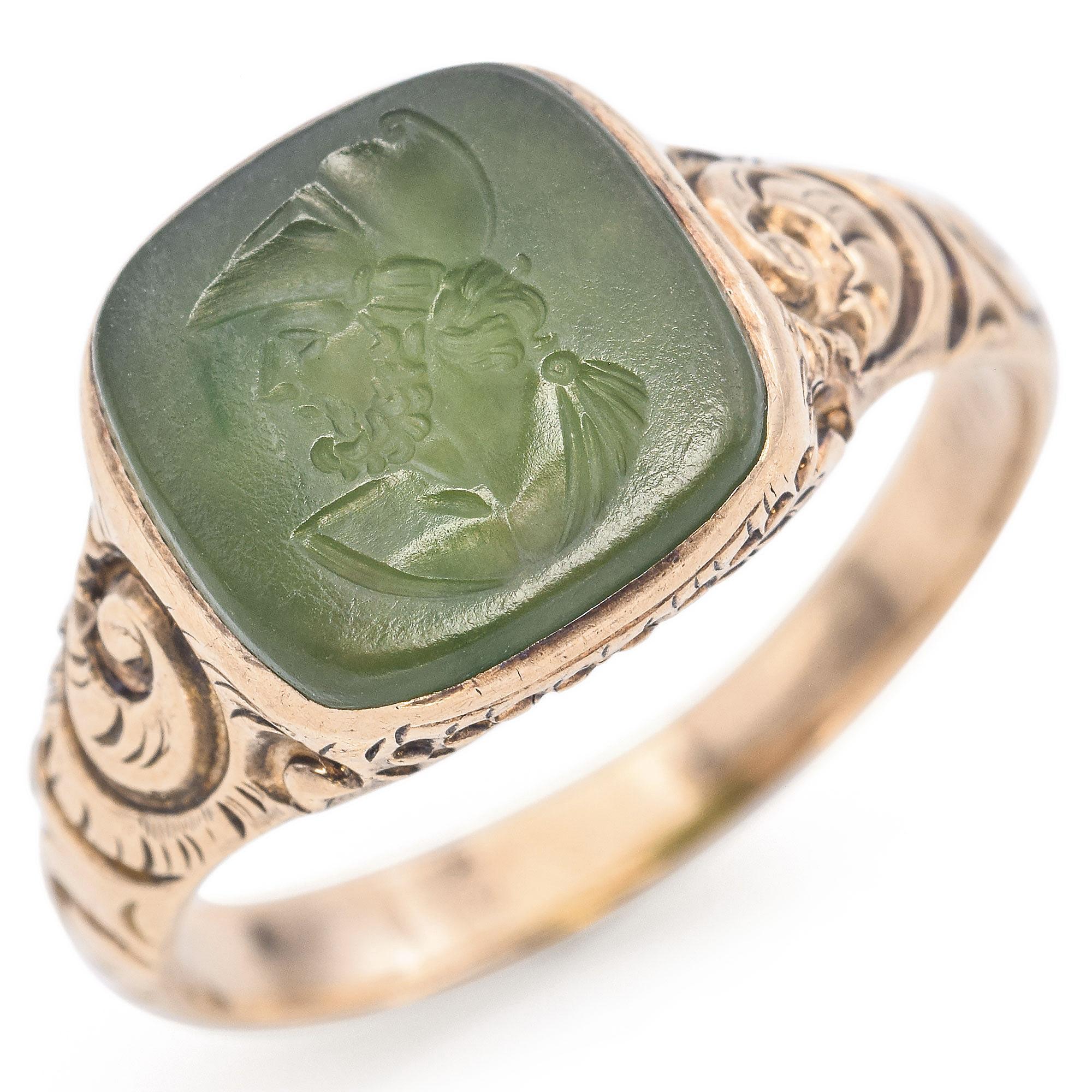 A distinctive and elegant ring featuring a 2 carat jade stone with an intaglio carving.
The ring showcases ornate detailing on the band, crafted in 10k yellow gold, enhancing the jade's natural beauty.
Created in 1911, this exquisite piece is both a