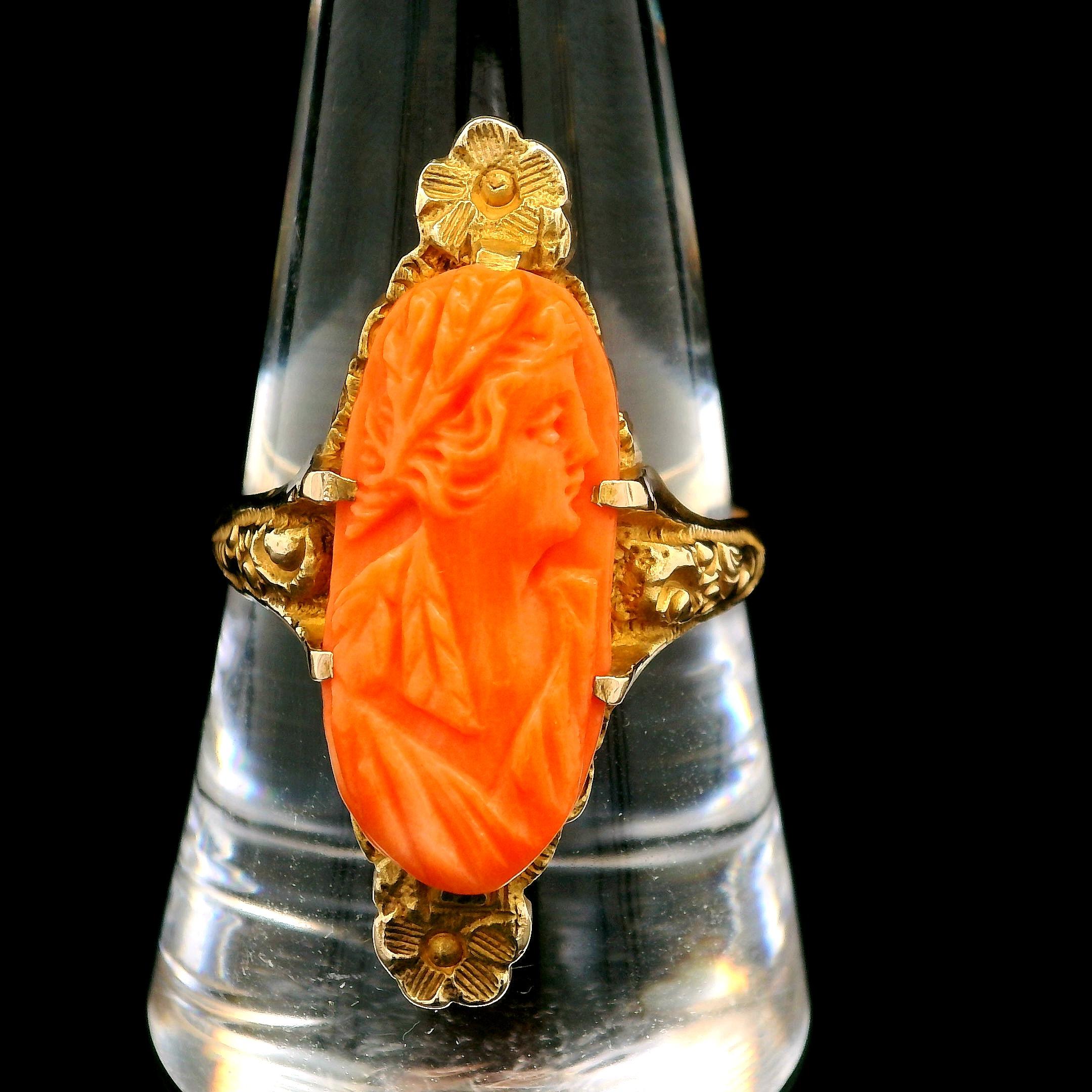 –Stone(s)–
(1) Natural Genuine Coral - Oval Carved Cameo - Prong Set - Gorgeous Rich Orange Color  - mm (approx.)
Material: Solid 10k Yellow Gold
Weight: 4.93 Grams
Ring Size: 9.5 ( fitted on finger, please contact us prior to purchase with sizing