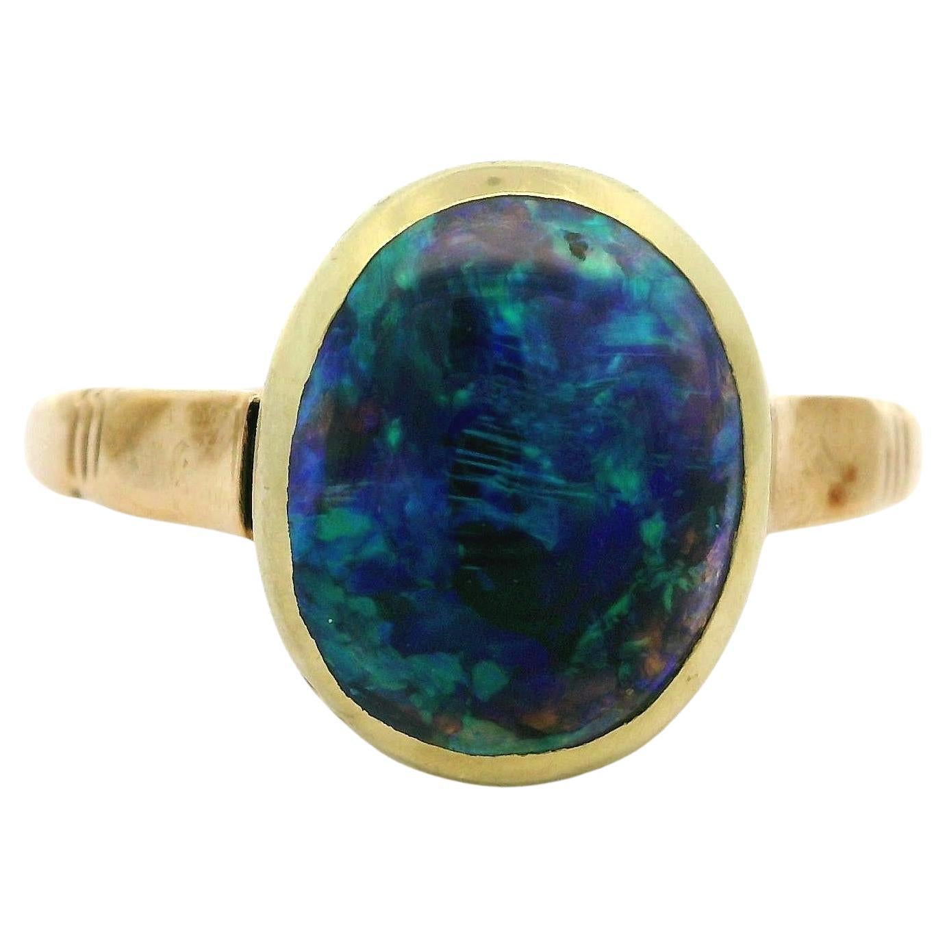 Anillo solitario con bisel de ópalo negro australiano de 3,40 ct en oro amarillo antiguo de 10k GIA