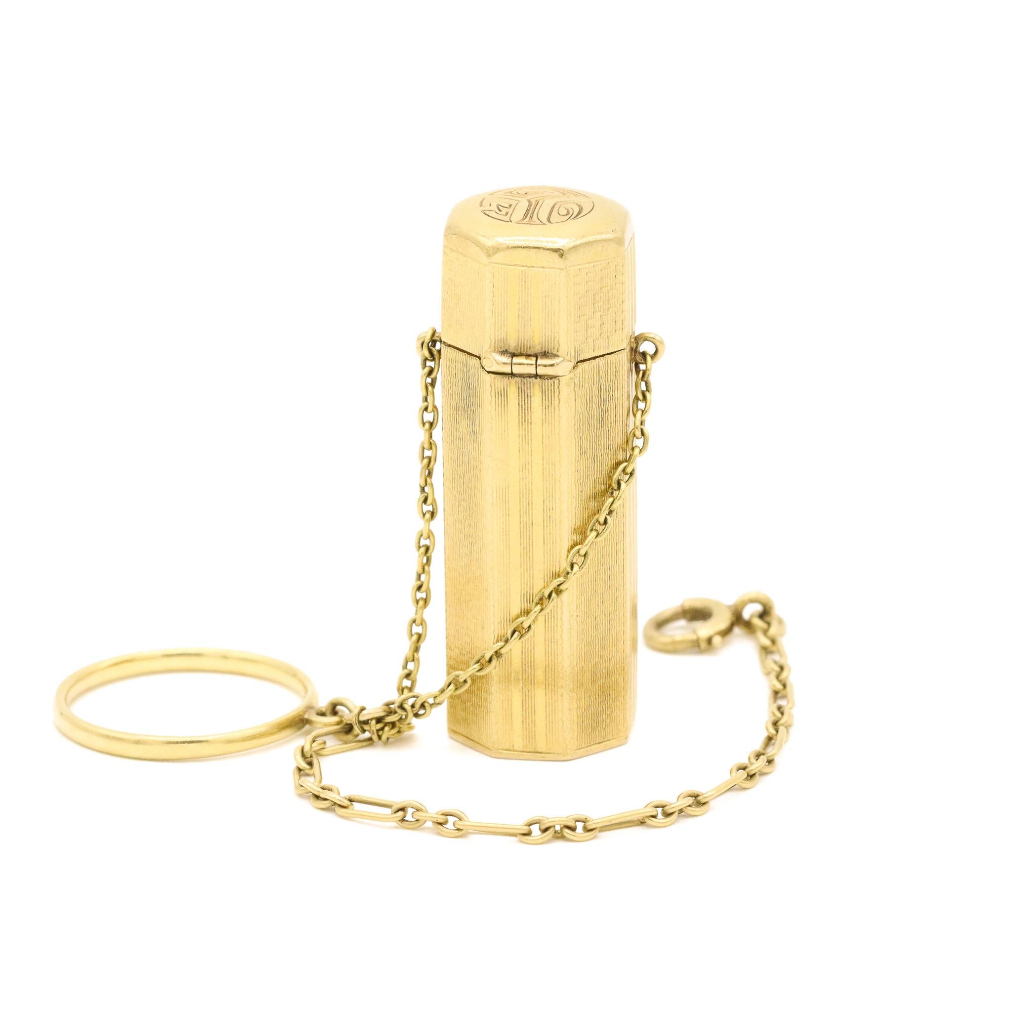 One lady's hand made 10K yellow gold, antique lipstick case . The lipstick case measures approximately 1.50 inches in length by 13.61mm tapering to 13.50mm in width and weighs a total of 15.20 grams. Engraved with 