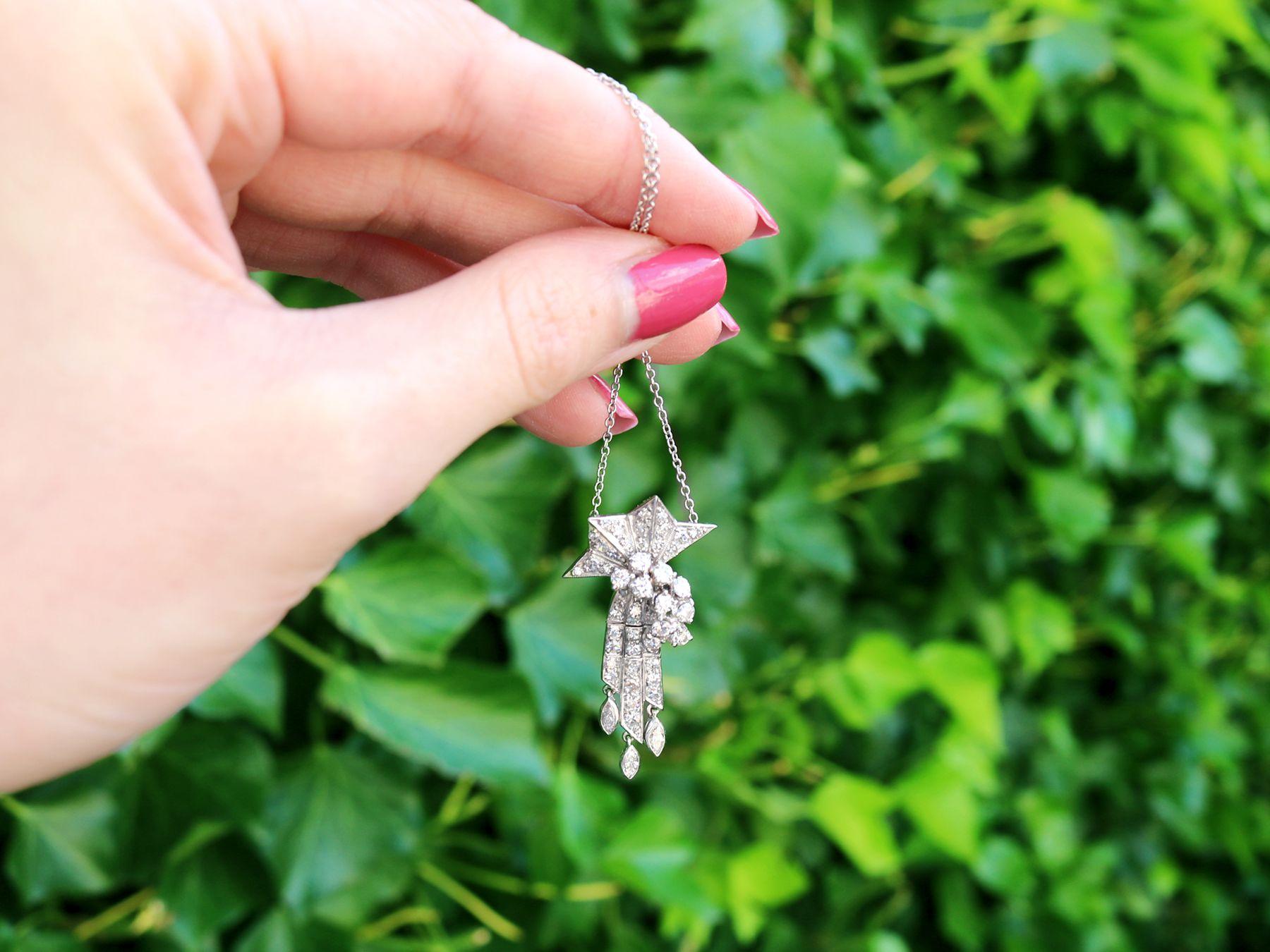 A stunning, fine and impressive 1.10 carat diamond and palladium, platinum set Art Deco tassel pendant; part of our diverse antique jewelry and estate jewelry collections.

This stunning, fine and impressive antique Art Deco necklace has been