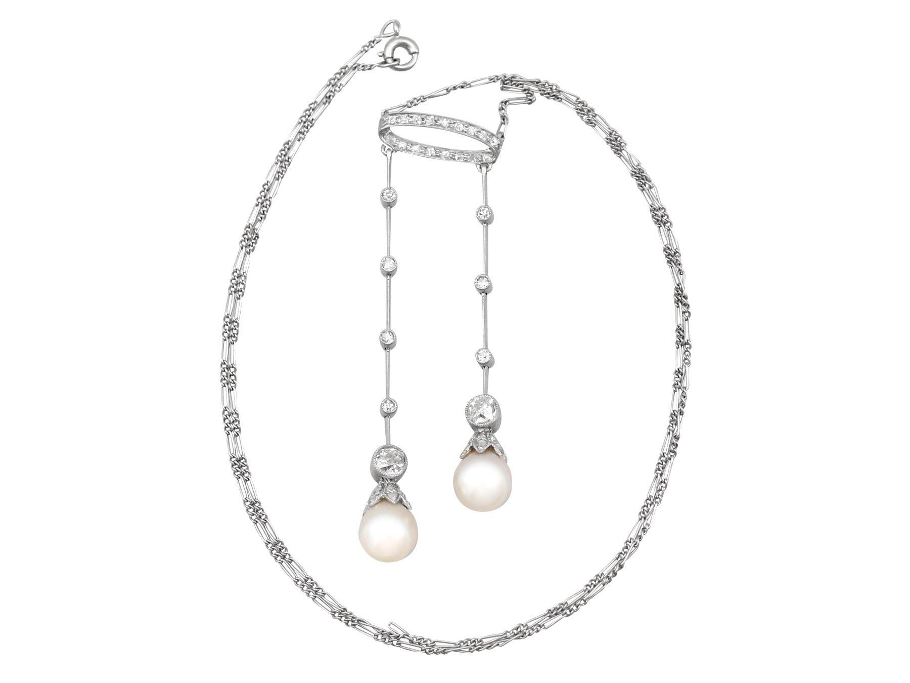 A stunning, fine and impressive antique 1900s 1.10 carat diamond and pearl, platinum drop necklace; part of our diverse antique jewelry and estate jewelry collections.

This stunning, fine and impressive antique pearl necklace has been crafted in