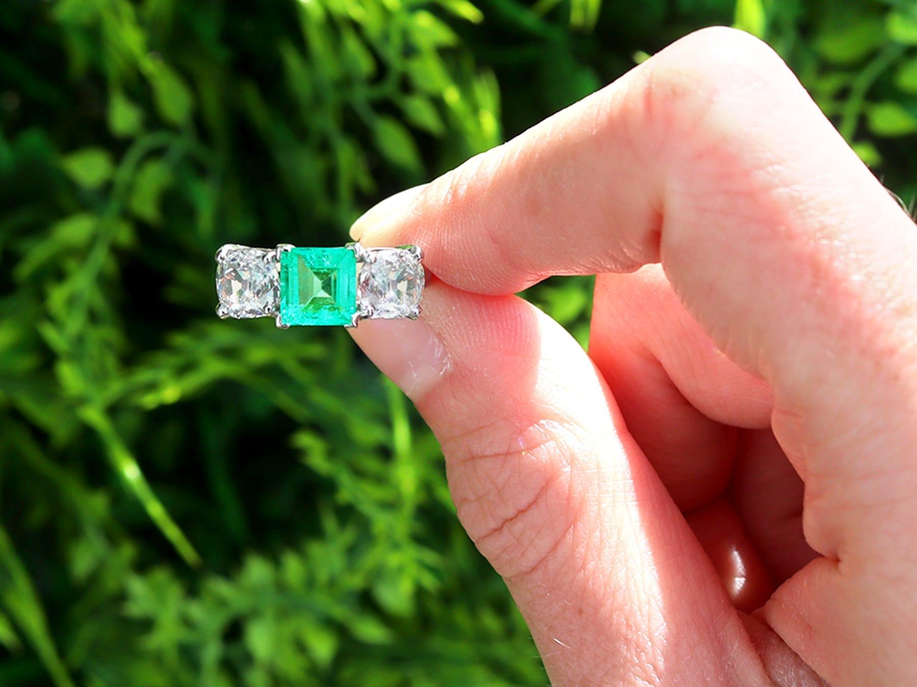 A stunning, fine and impressive antique 1.11 carat Colombian emerald and 1.33 carat diamond, platinum trilogy ring; part of our diverse engagement ring collections.

This stunning, fine and impressive antique emerald and diamond ring has been