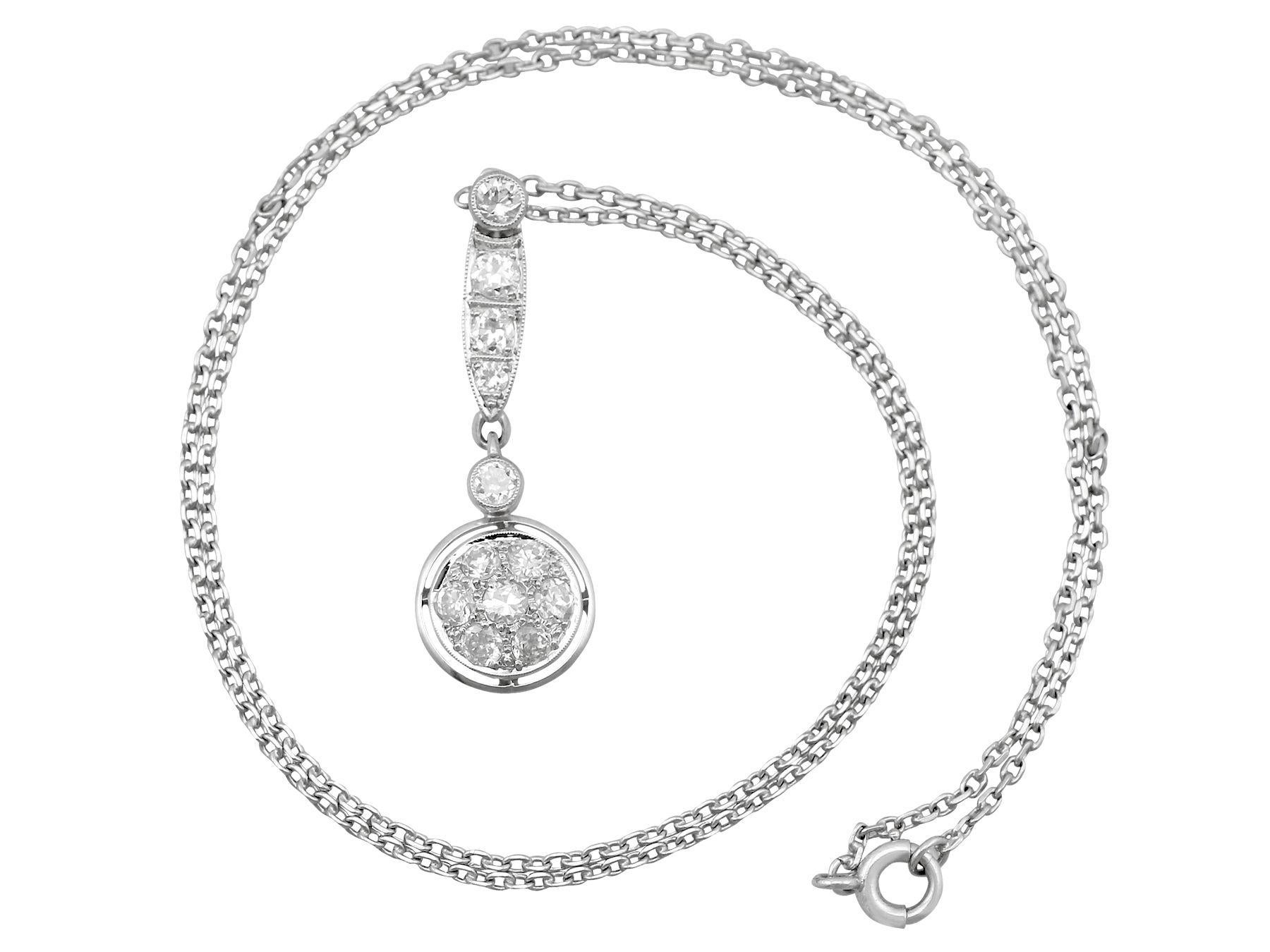 This fine and impressive antique diamond necklace has been crafted in platinum.

The pierced decorated linear drop is ornamented to the lower border with a circular frame, embellished with seven pavé set Old European round cut diamonds, and a single