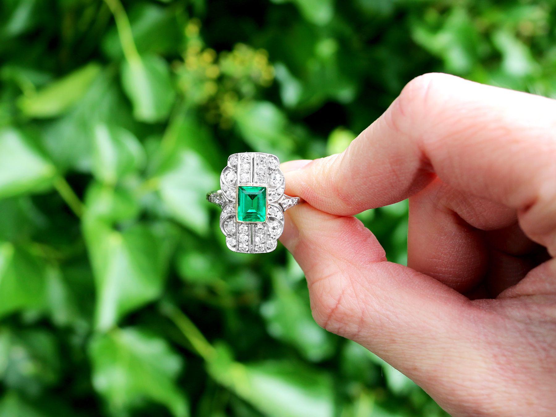 A stunning, fine and impressive 1.13 carat emerald, 1.11 carat diamond, 18 karat yellow gold and platinum dress ring; part of our diverse gemstone jewelry and estate jewelry collections

This stunning, fine and impressive emerald ring with diamonds