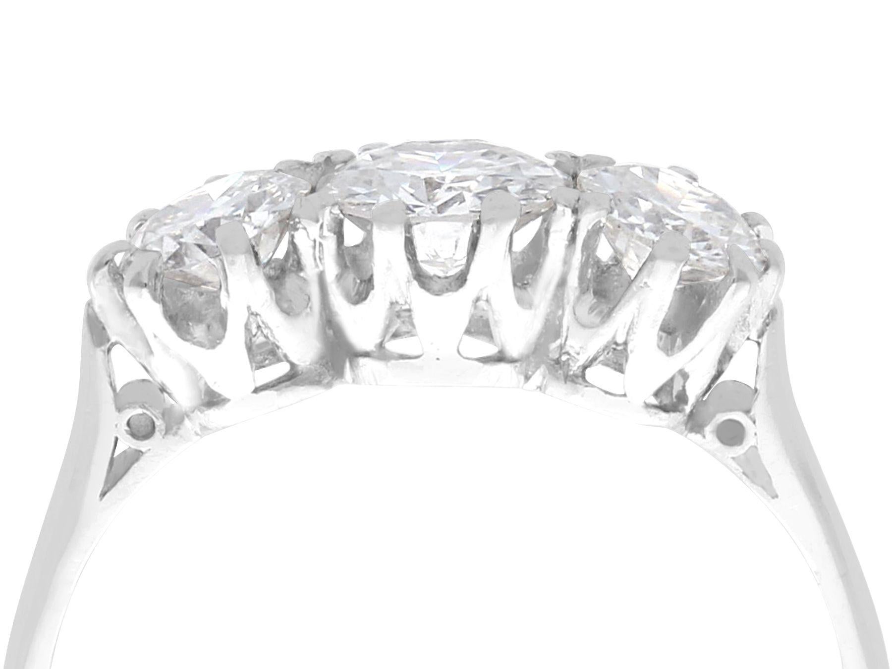 A fine and impressive antique 1.16 carat diamond and platinum three stone ring; part of our diamond jewellery collections.

This impressive diamond platinum trilogy diamond ring has been crafted in platinum.

The antique ring displays three