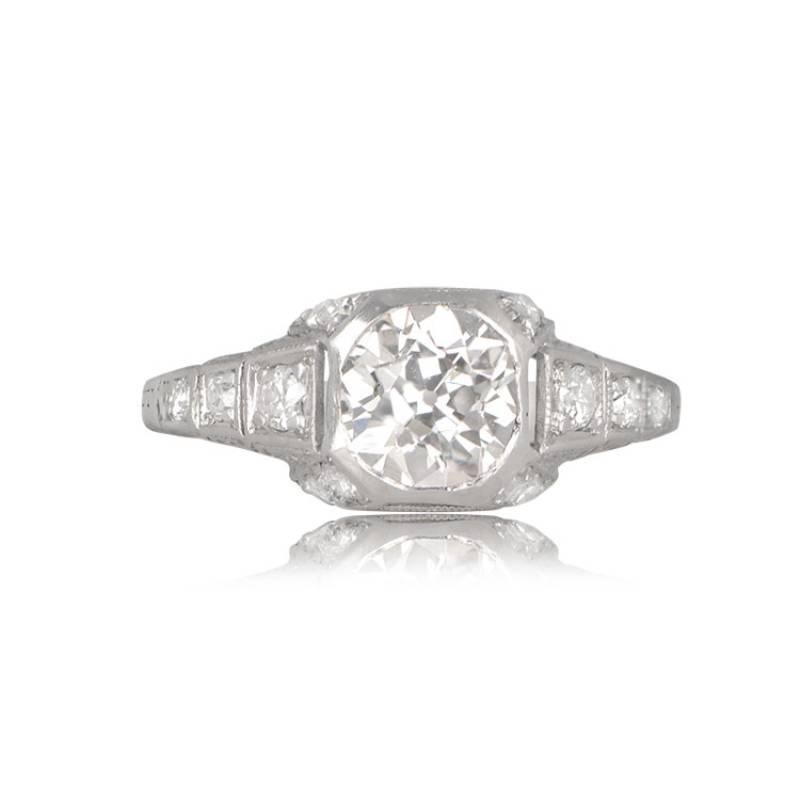 A captivating Art Deco ring with a 1.17-carat old European cut diamond set in a platinum band adorned with filigree and additional old European cut diamonds. Crafted around 1920, the center diamond is approximately 1.17 carats, J color, and VS1