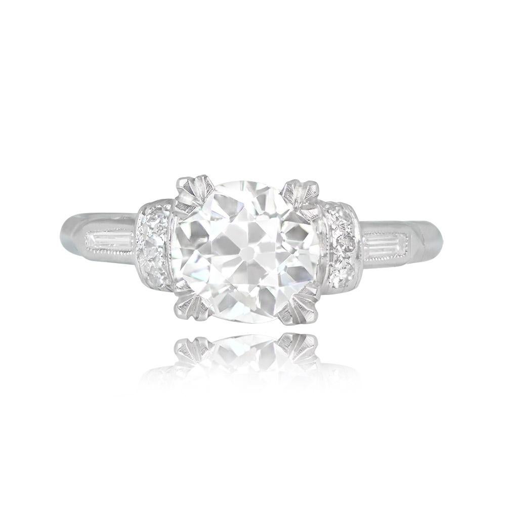 This stunning Art Deco engagement ring boasts a 1.19-carat old European cut diamond at its center, with I color and SI2 clarity, elegantly secured in prongs. On either side of the center stone, a vertical row of single-cut diamonds adds a touch of
