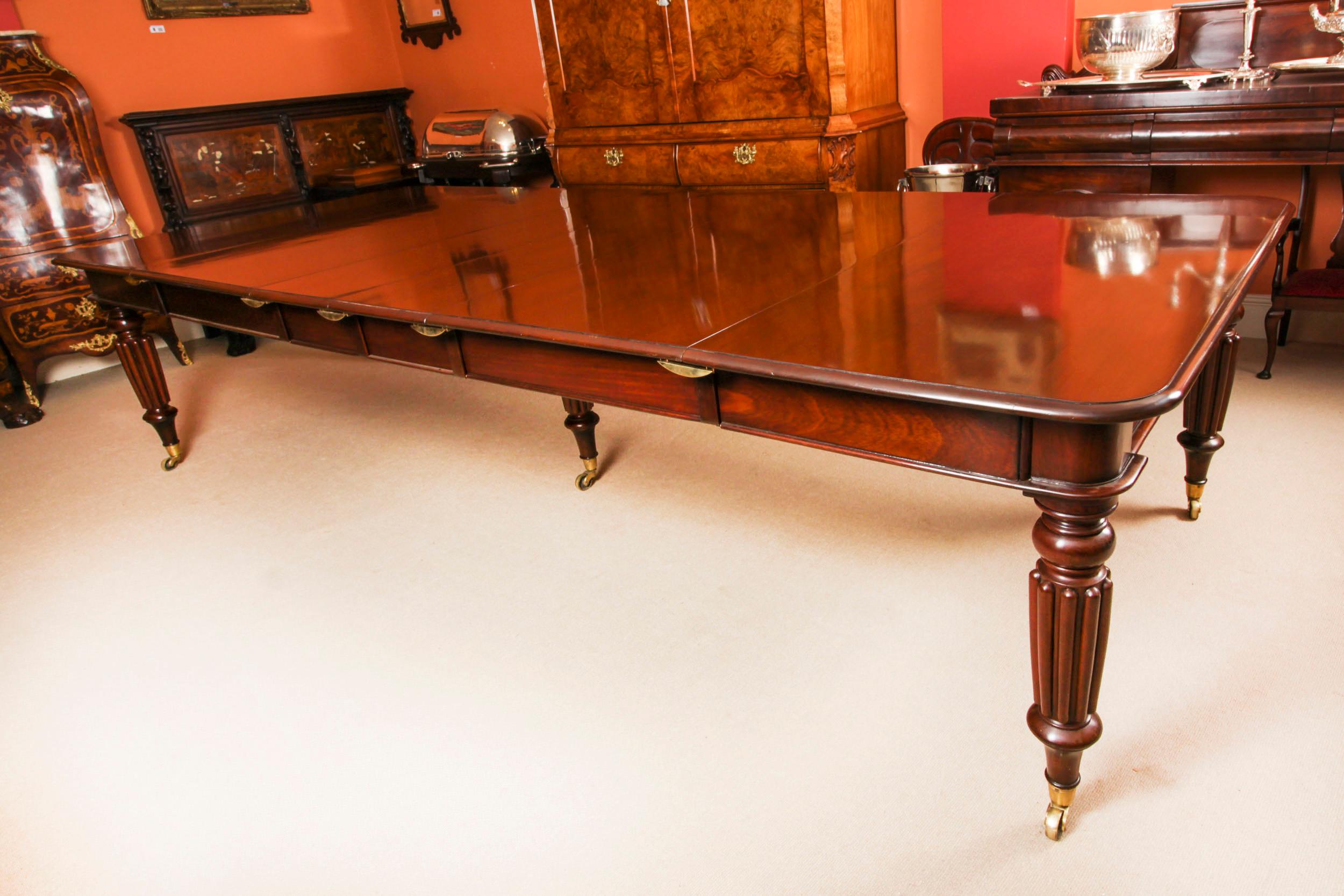 A very rare opportunity to own a superb dining set comprising an early antique William IV flame mahogany extending  dining table in the manner of Gillows of Lancaster, with a Vintage set of 12 Wheatsheaf Shieldback Dining Chairs.

The table top