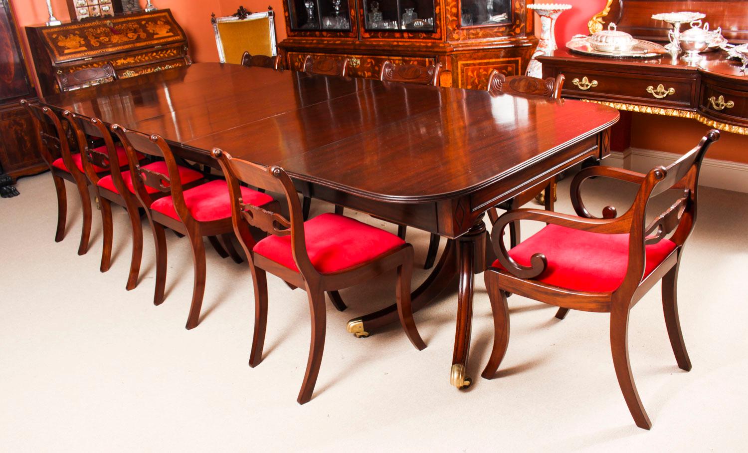 This is an elegant antique 11ft Regency Period dining table that can comfortably seat twelve people, circa 1820 in date.

The table is of rectangular form with rounded corners and reeded edge. It is raised on twin 