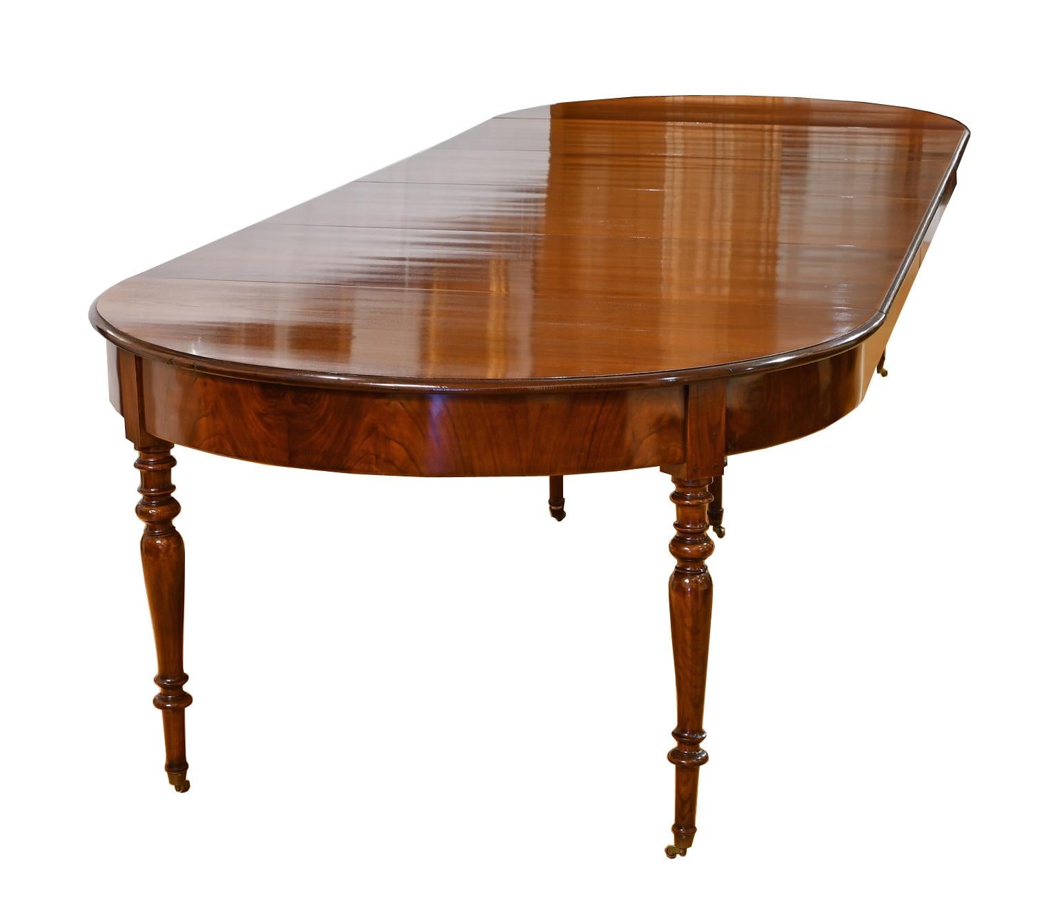 A very beautiful antique Christian VIII dining table in fine West Indies (Cuban) mahogany with four leaves that extend it to 12 feet in length. Table features a racetrack top with ebonized ogee edge, skirted leaves & finely-turned legs. The fine