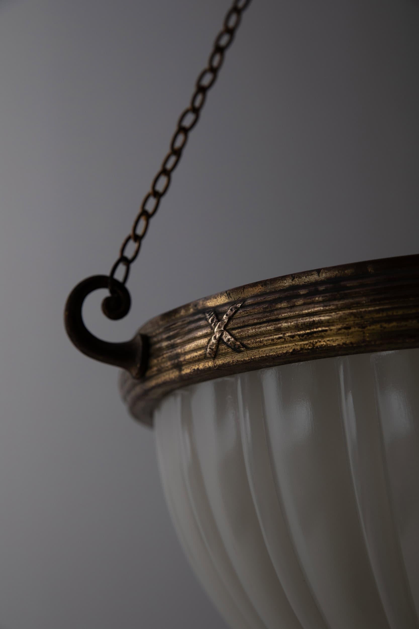 A very elegant pressed glass Jefferson 'Moonstone' plafonnier lamp. c.1930

Heavy duty pressed milk glass of fluted design, supported by a beautiful gilt brass GEC ring, with chain, three-way hanger and ceiling hook. Chains can be shortened to suit