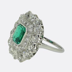 Antique 1.20 Carat Emerald and Diamond Cluster Ring