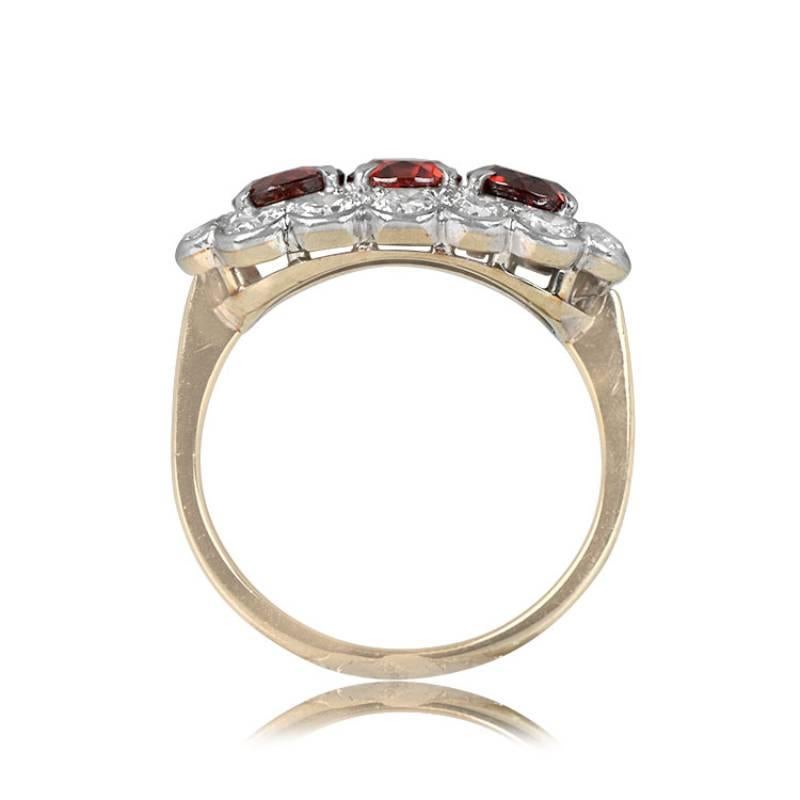 An antique three-stone cocktail ring showcasing round-cut natural Garnets, each approximately 0.40 carats, encircled by a halo of old European cut diamonds. The total Garnet weight is about 1.20 carats, while the diamonds total around 1.40 carats.
