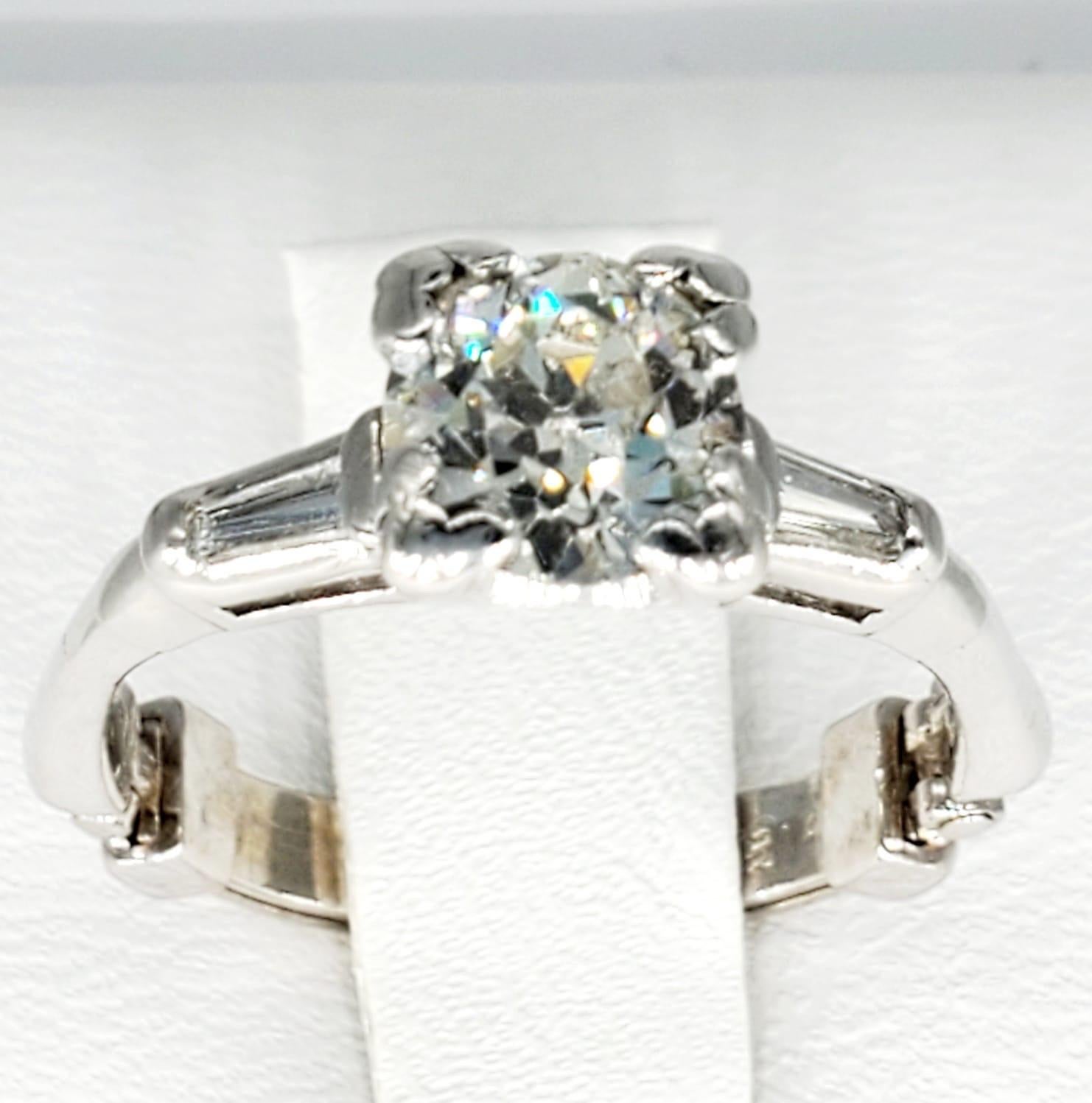Antique 1.21 Carat Old Mine Cut Diamond Self Size Able Engagement Ring. The center diamond is an old mine diamonds that weights approx 1.01 carat and is a H/VS Clarity. The baguette diamonds on the sides weight a total of 0.20 carats H/VS Clarity.