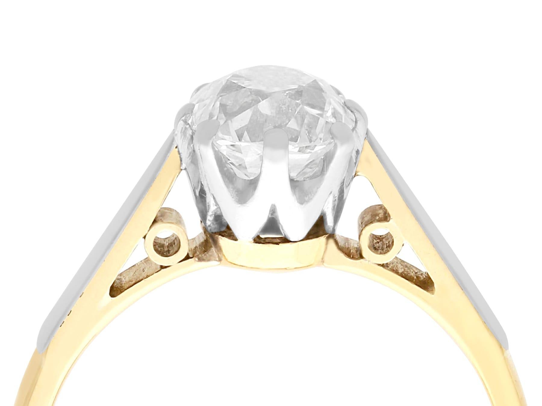 A stunning, fine and impressive 1.23 carat diamond, 18 karat yellow gold and platinum set solitaire ring; part of our diamond jewelry and estate jewelry collections.

This impressive antique Edwardian solitaire ring has been crafted in 18k yellow