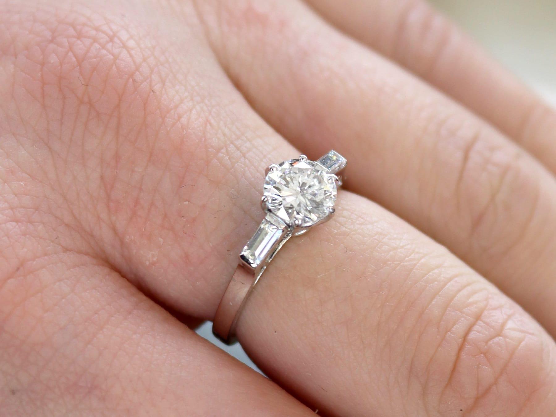 A stunning, fine and impressive antique 1.24 carat (total) diamond solitaire ring in platinum; part of our antique engagement ring collections.

This stunning, fine and impressive antique diamond solitaire engagement ring has been crafted in