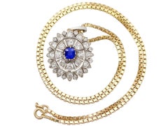 Antique 1.25 Carat Sapphire and 3.43 Carat Diamond Yellow Gold Pendant Brooch