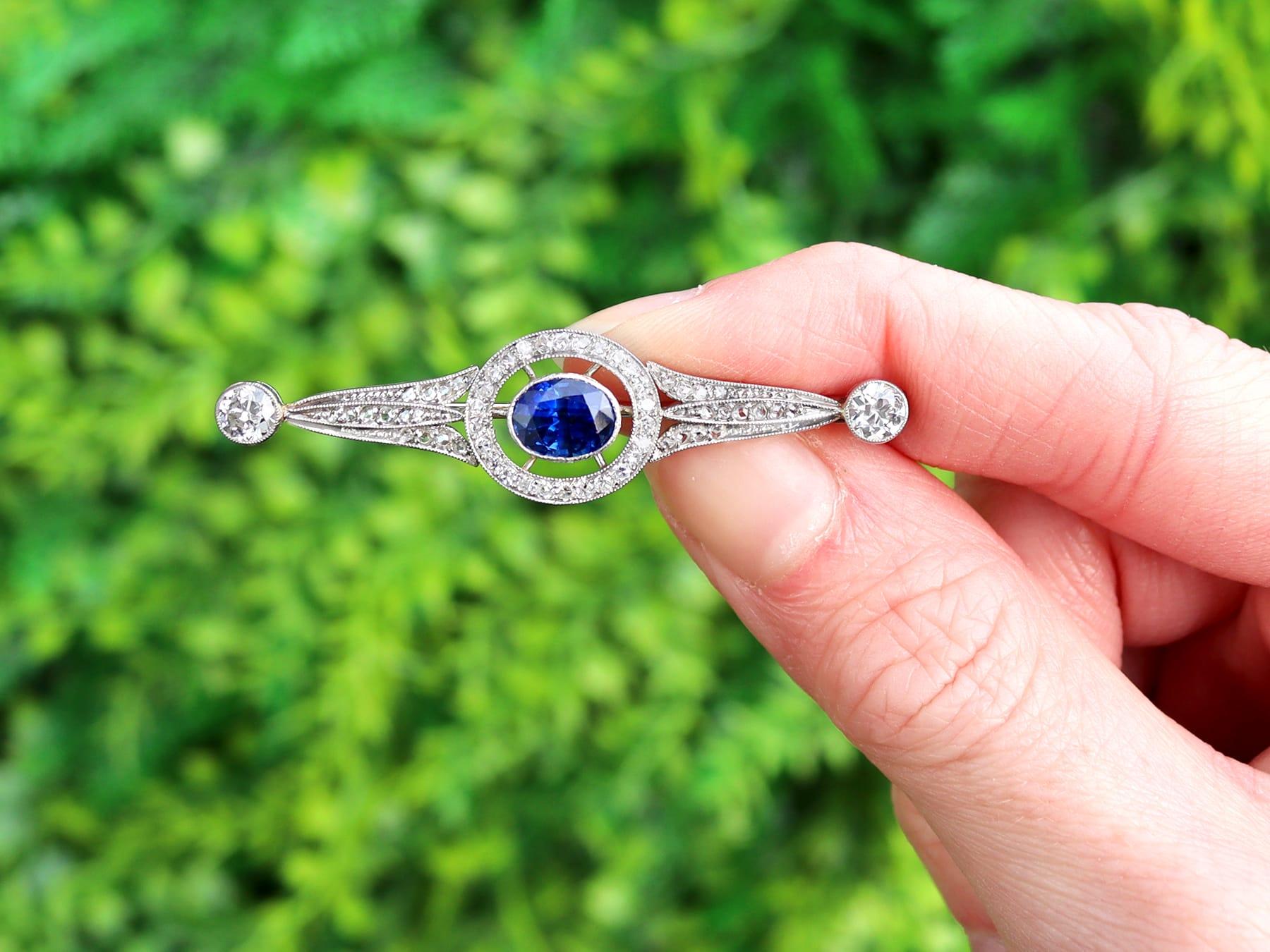 A fine and impressive 1.25 carat sapphire and 2.34 carat diamond, platinum brooch; part of our diverse antique sapphire jewelry collections.

This fine and impressive antique brooch has been crafted in platinum.

The pierced decorated bar design is