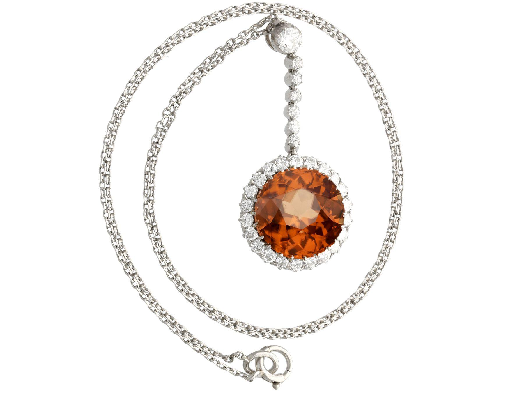 A stunning, fine and impressive antique 12.69 carat zircon and 1.04 carat diamond, palladium necklace with a platinum chain; part of our diverse antique jewelry and estate jewelry collections.

This stunning, fine and impressive antique pendant has