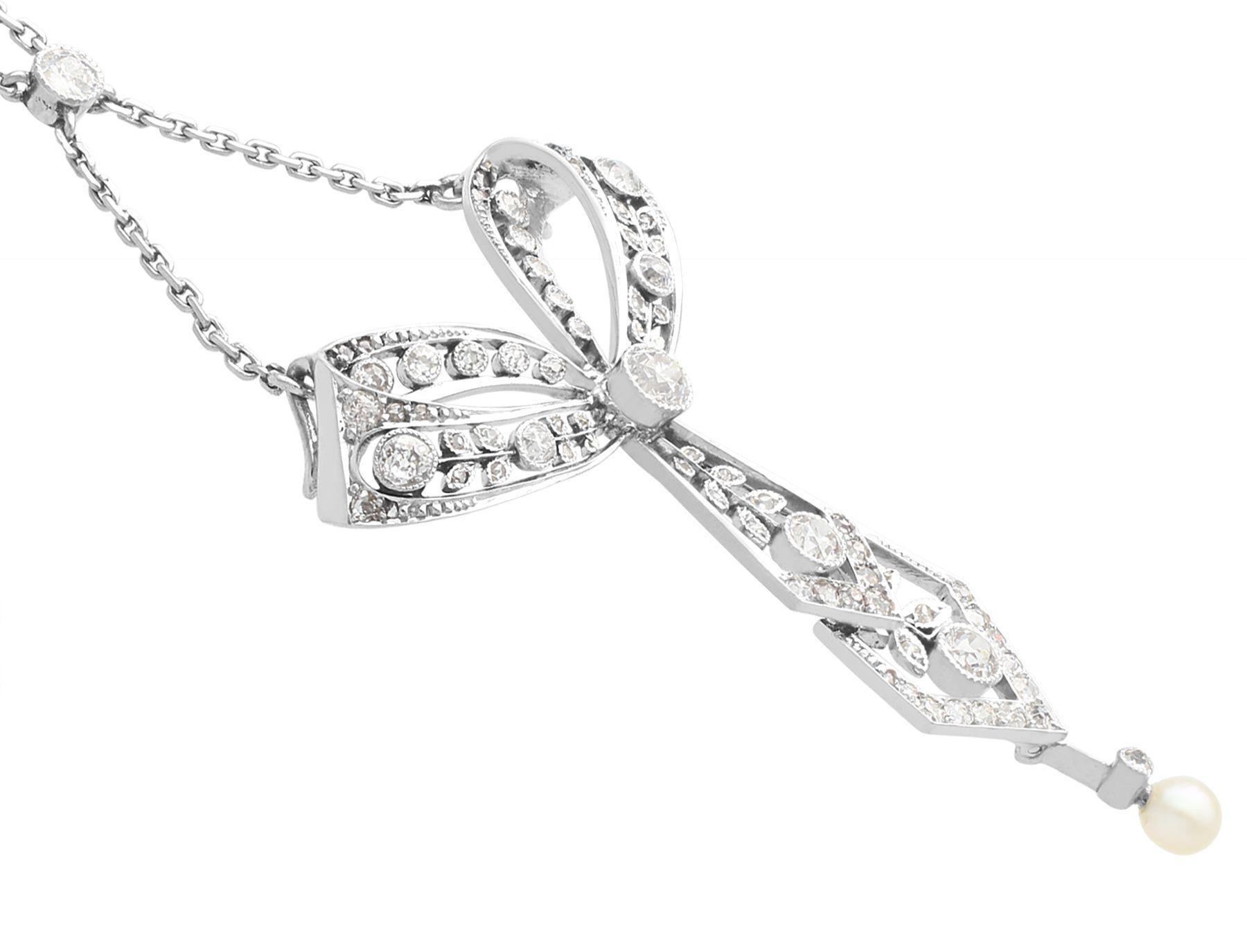 Antique 1.29ct Diamond and Pearl Platinum Bow Pendant, circa 1900 In Excellent Condition For Sale In Jesmond, Newcastle Upon Tyne