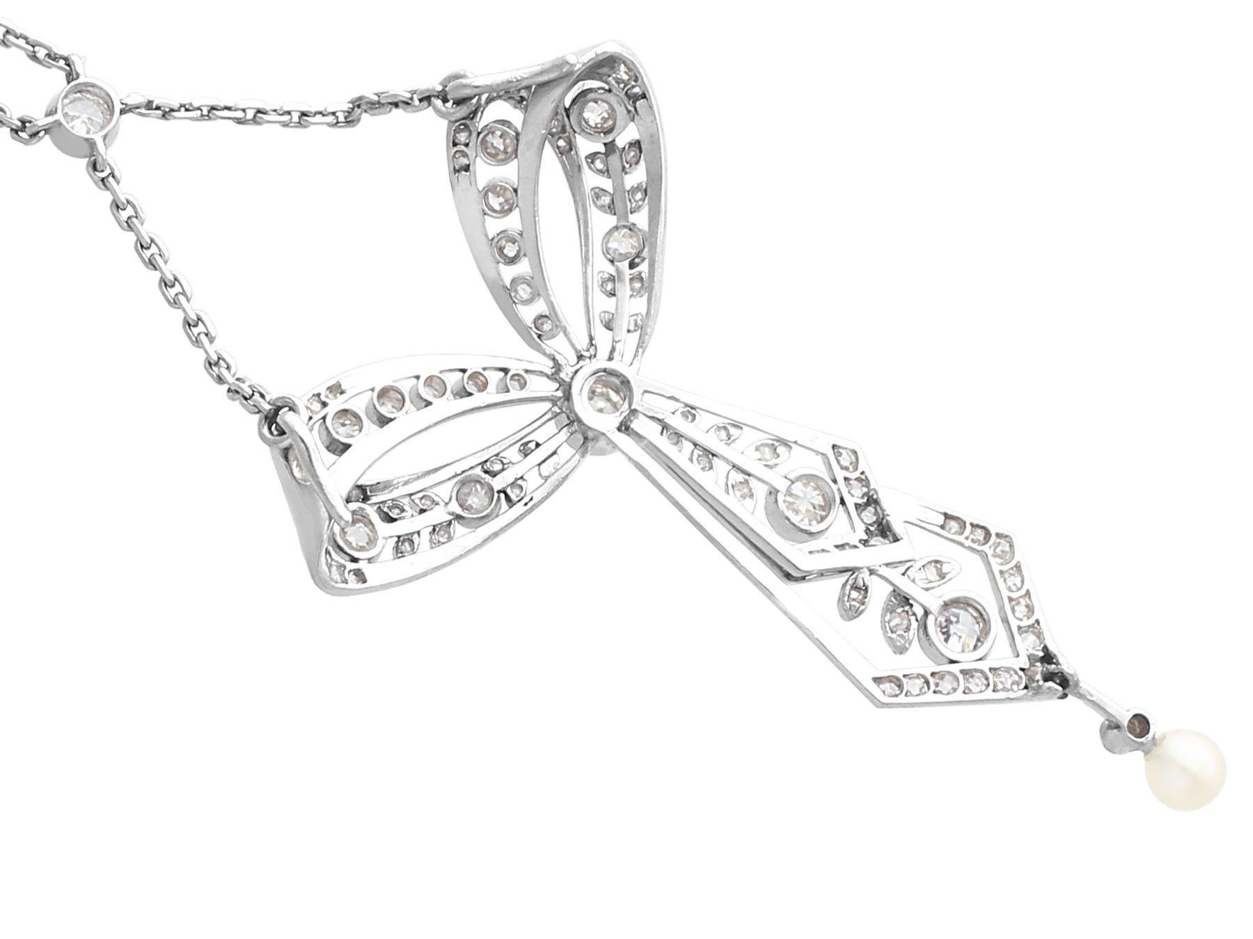 Women's or Men's Antique 1.29ct Diamond and Pearl Platinum Bow Pendant, circa 1900 For Sale