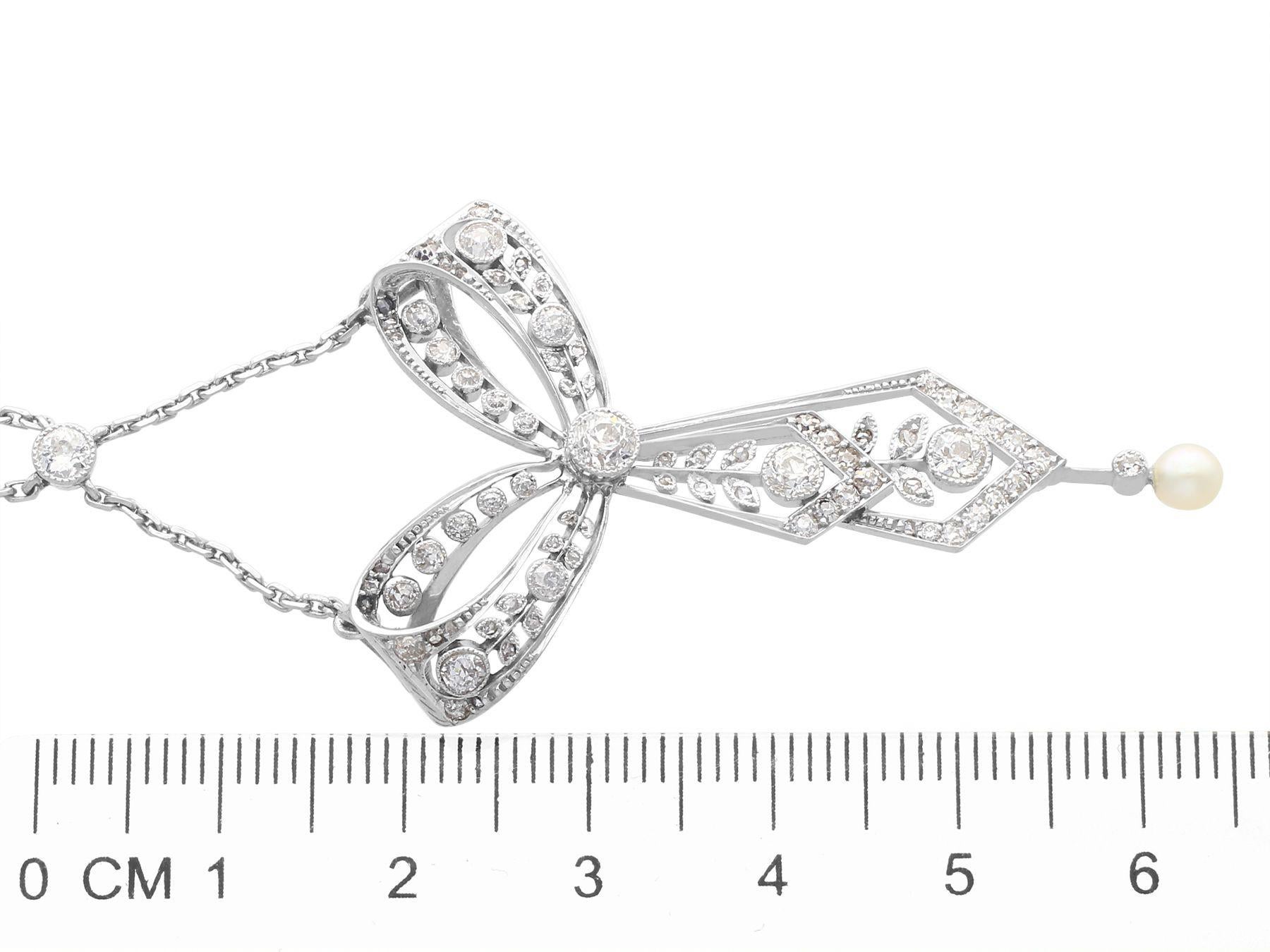 Antique 1.29ct Diamond and Pearl Platinum Bow Pendant, circa 1900 For Sale 1