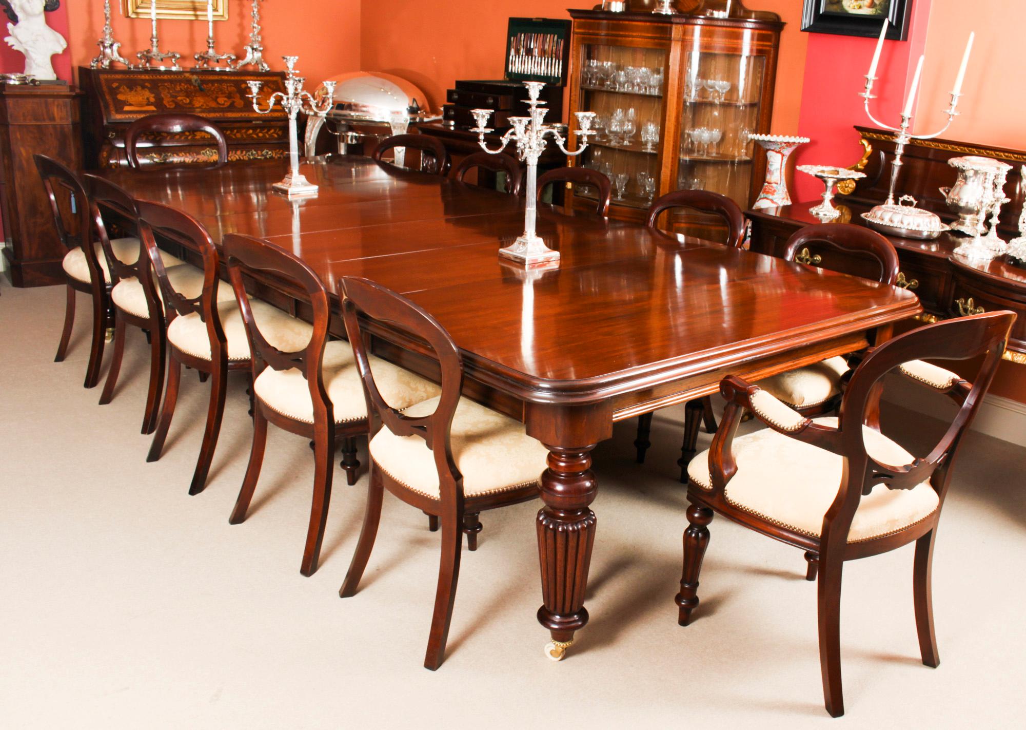 This is a rare opportunity to own an antique early Victorian, flame mahogany dining or conference table, circa 1850 in date and a set of 12 Victorian revival balloon back dining chairs.

The superb dining table has four original leaves which can be