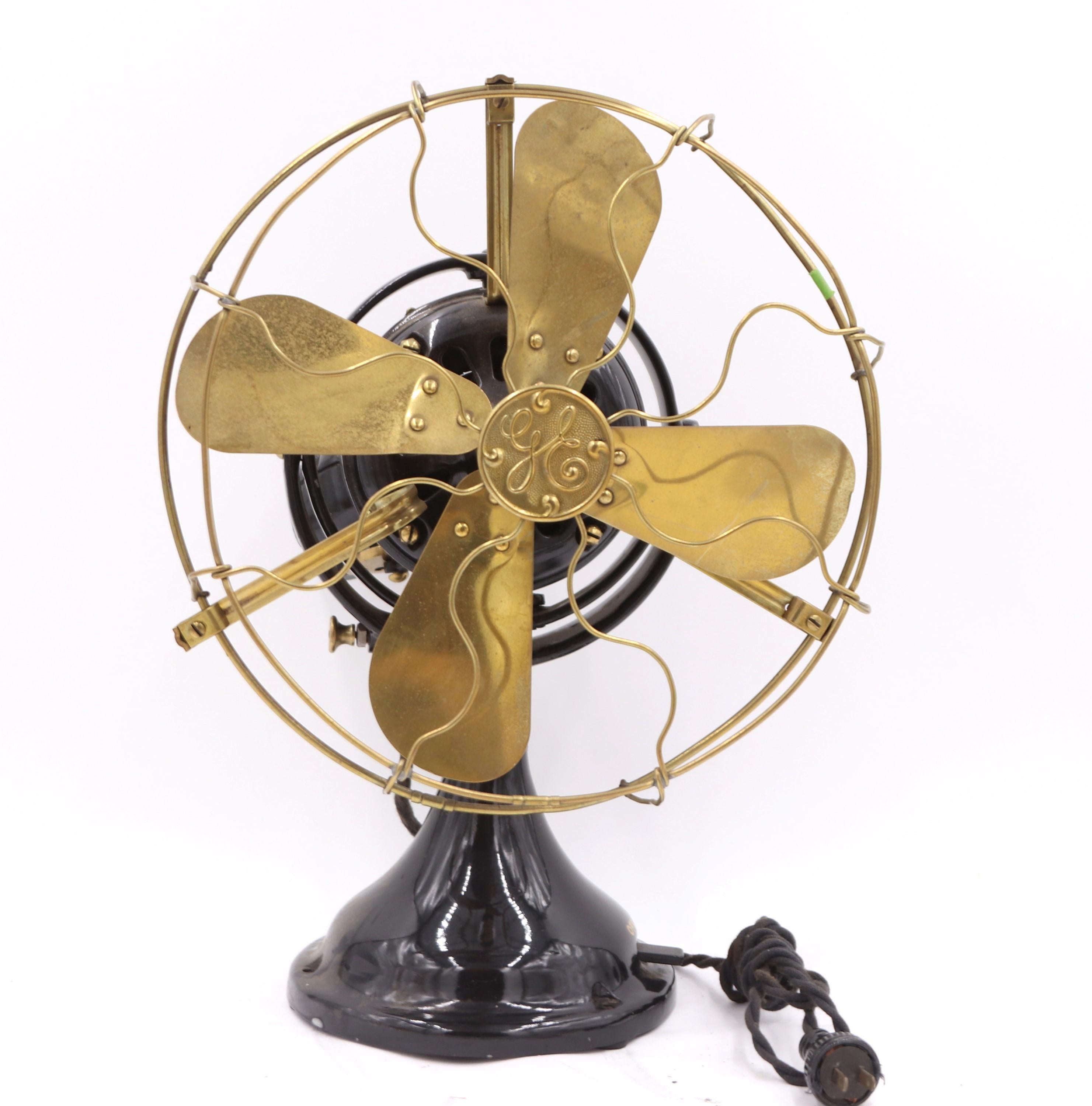 Early 1900s General Electric desk fan with polished brass blades and black base. Made by General Electric. The GE label indicates it was patented in 1901. It runs well but does not oscillate. There is some damage to the back. Please see the photos.