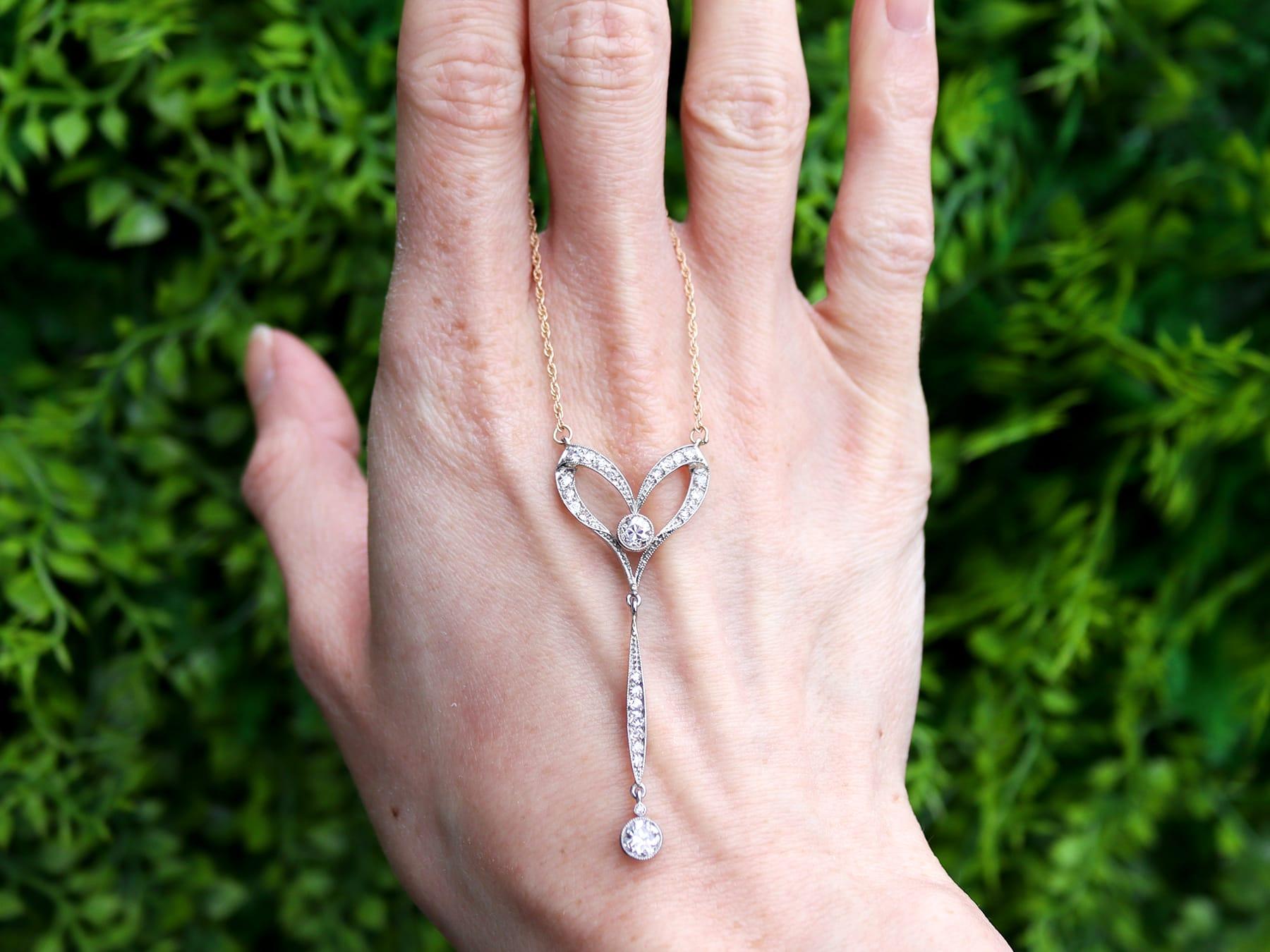 A stunning, fine and impressive antique 1.30 carat diamond, 15 karat yellow gold and platinum set pendant; part of our 1920s jewelry collection.

This stunning, fine and impressive antique diamond pendant has been crafted in 15k yellow gold with a