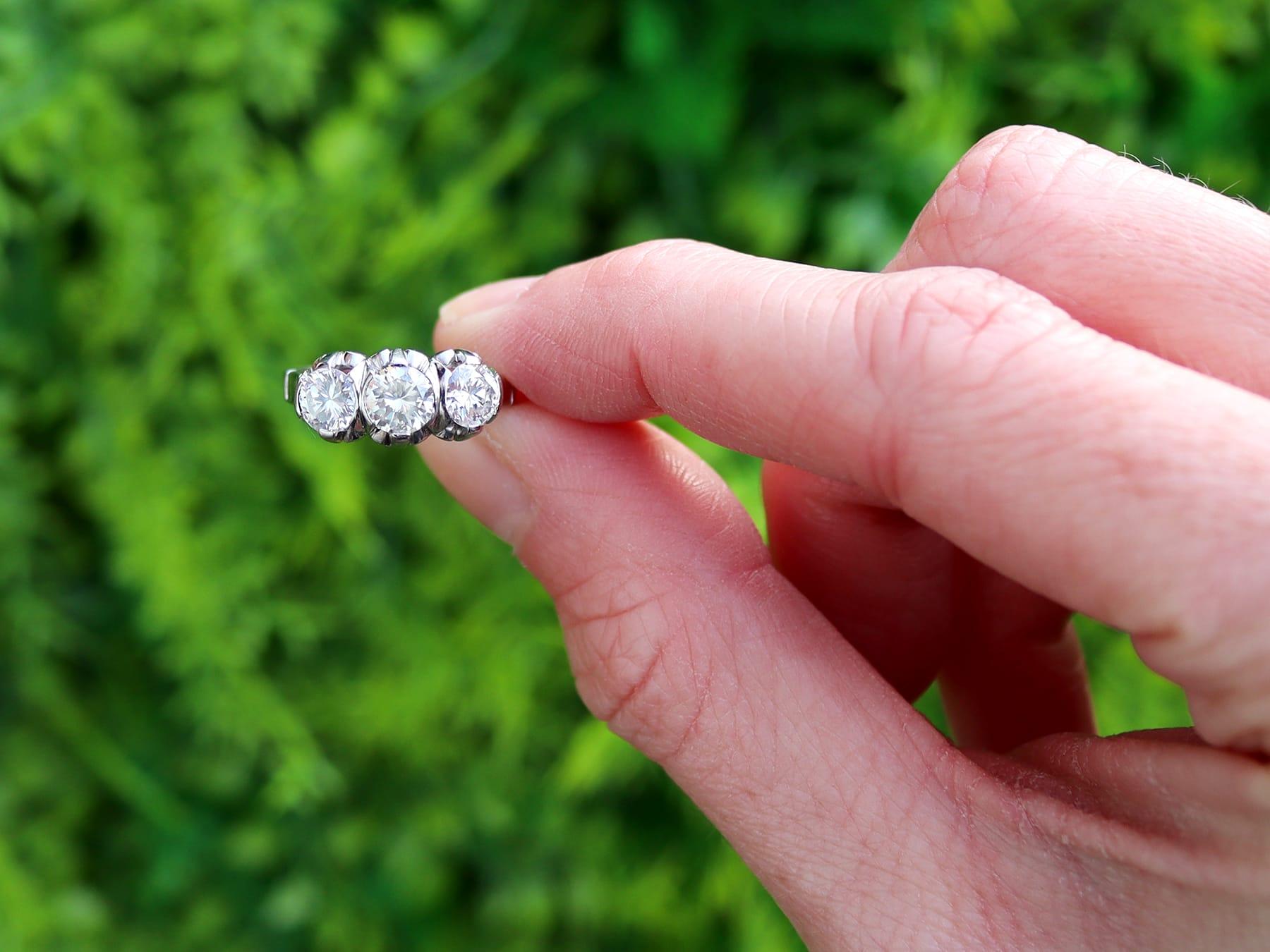 A stunning, fine and impressive antique 1.30 carat diamond and platinum trilogy ring; part of our diverse collection of antique three stone diamond rings.

This fine and impressive antique trilogy ring has been crafted in platinum.

The pierced