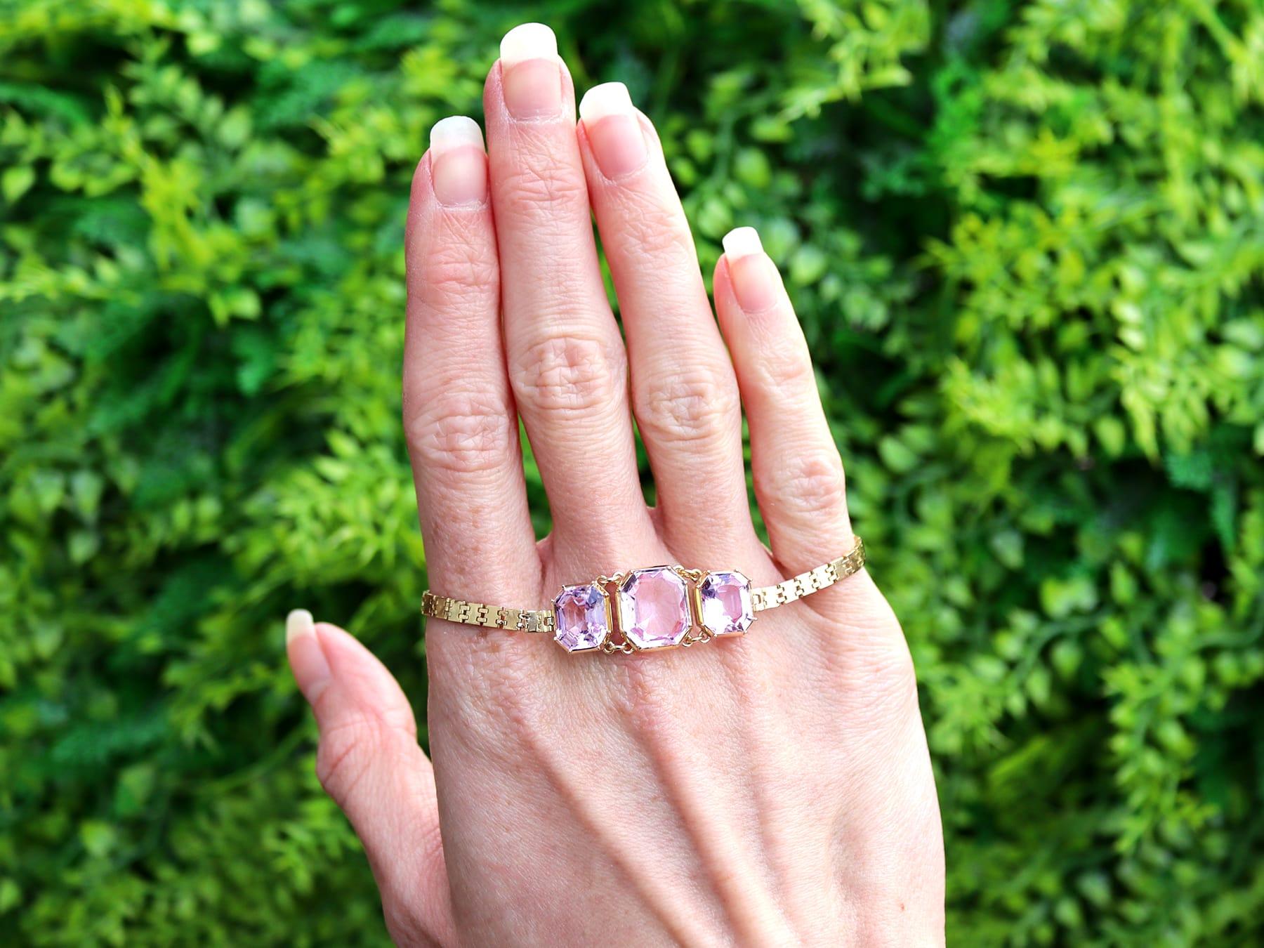 A stunning, fine and impressive antique Victorian 13.20 carat pink topaz and 18 karat yellow gold and 15 karat yellow gold set bracelet; part of our bangle and bracelet collection.

This stunning fine and impressive antique bracelet has been crafted