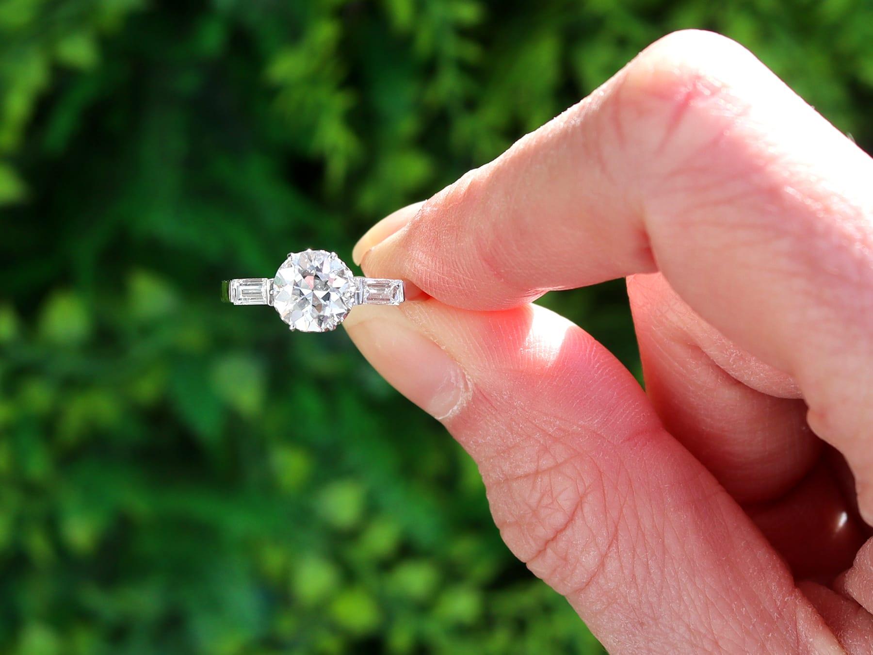 A stunning, fine and impressive antique 1.32 carat diamond and platinum solitaire ring with baguette side stones; part of our engagement ring collection.

This stunning, fine and impressive antique diamond ring has been crafted in platinum.

The