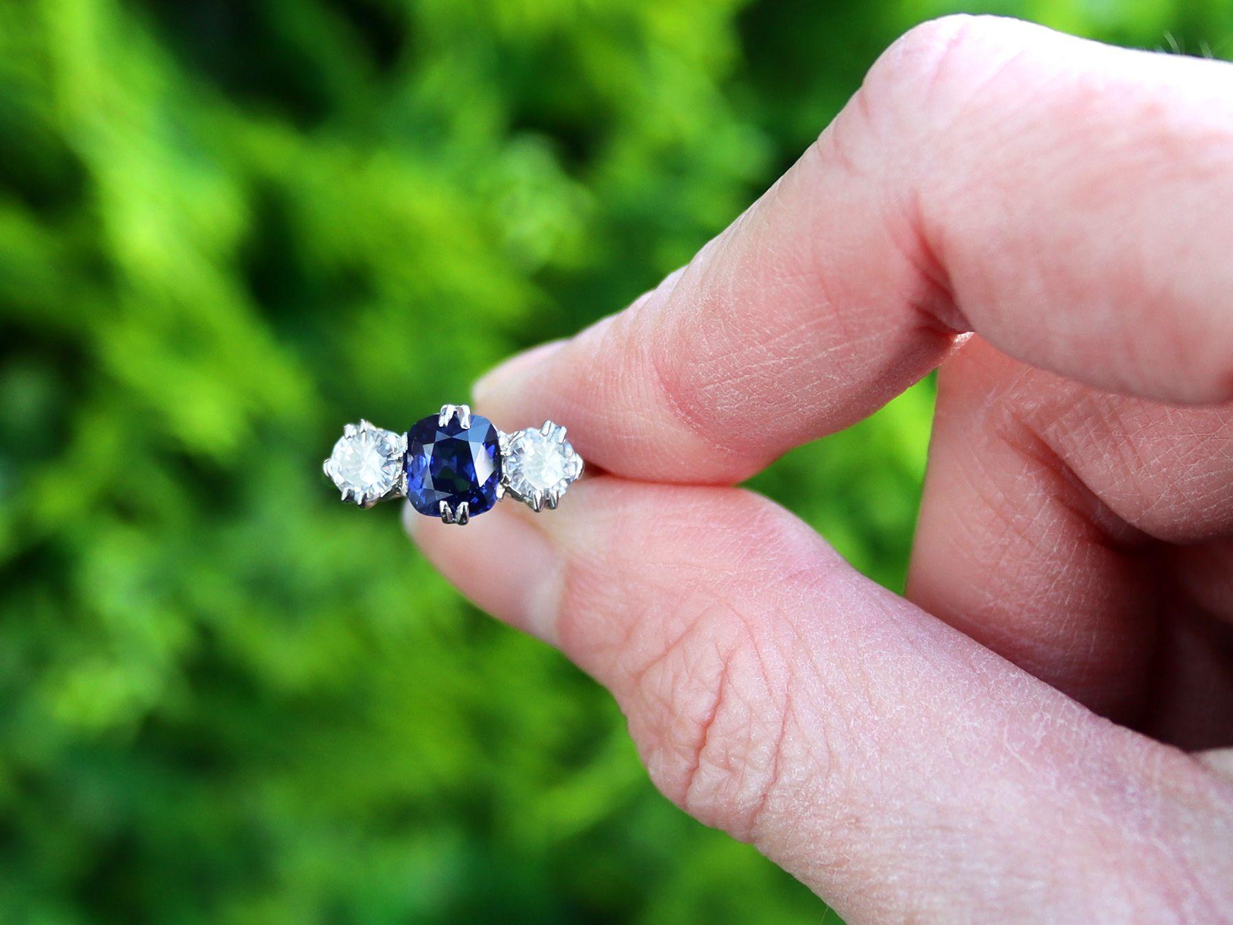 A stunning, fine and impressive antique 1.33 carat Basaltic sapphire and 0.88 carat diamond, platinum trilogy ring; part of our diverse antique jewelry and estate jewelry collections.

This stunning, fine and impressive trilogy sapphire ring has