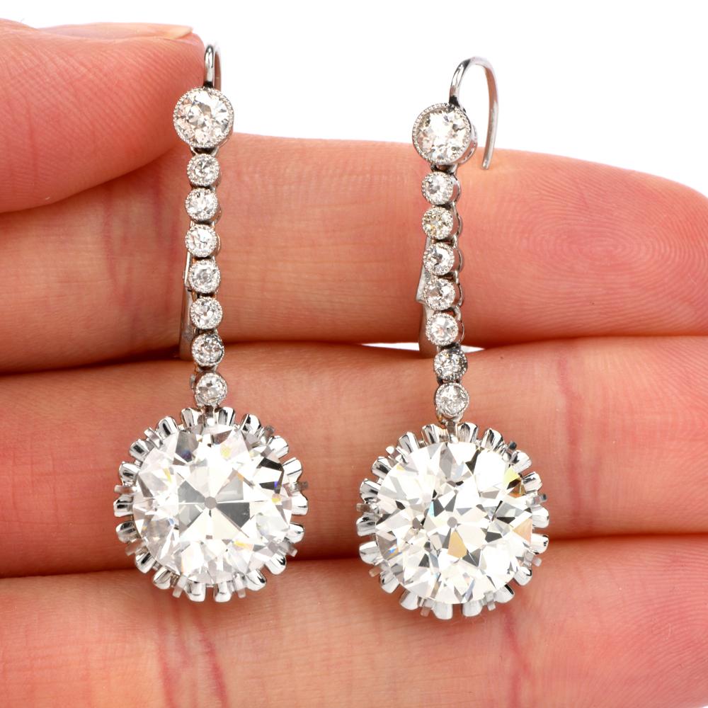 Be the Queen of the Ball

as you wear these antique sensual dangling diamond earrings!

A simple, glistening string of diamonds suspends

the buttercup mounted, prong set, old European cut, large

high quality and color round DIamonds.

These 2
