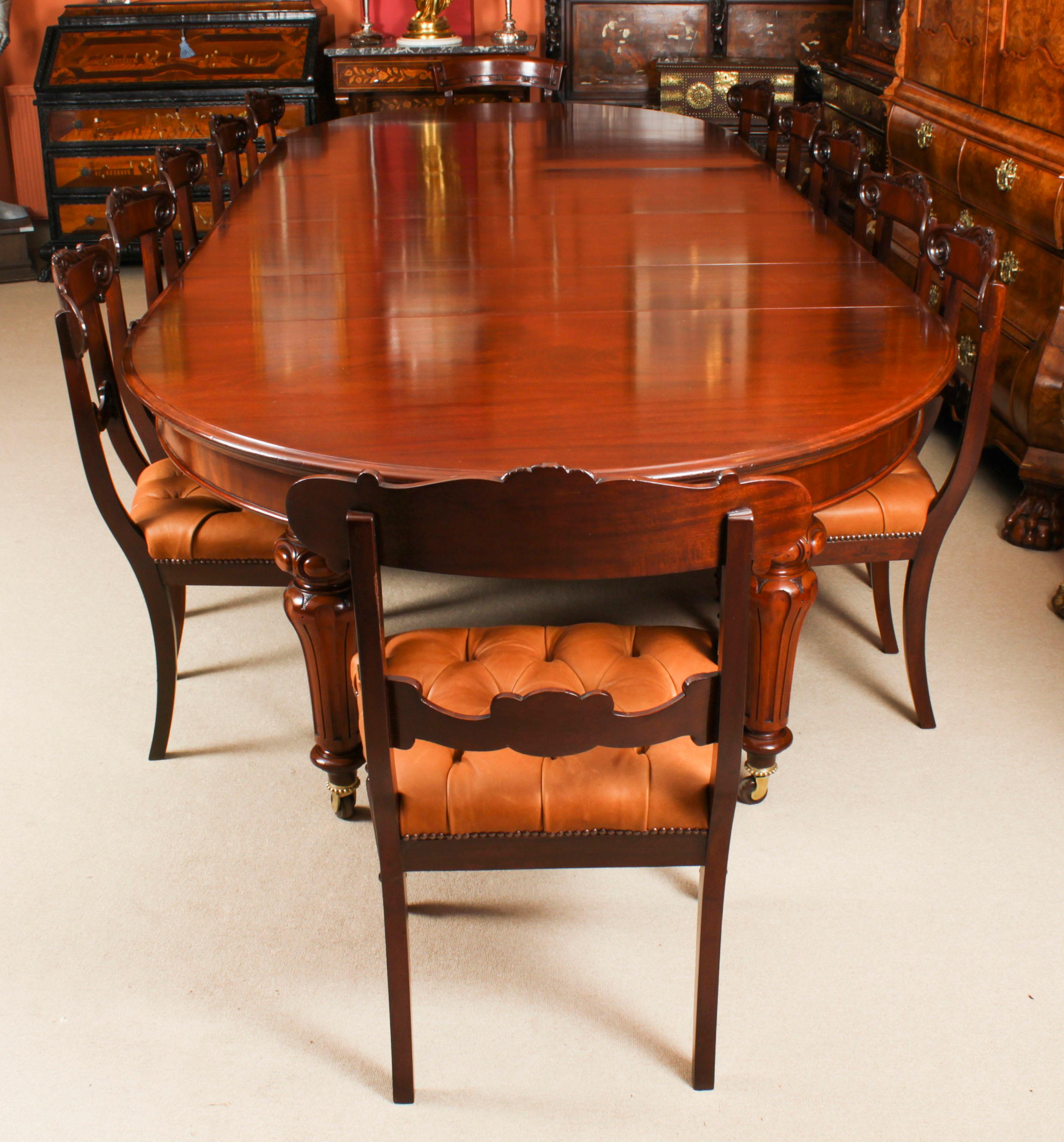 This is a fabulous large antique William IV oval ended flame mahogany extending dining table with a stunning set of twelve William IV  dining chairs, all circa 1830 in date. 

The table has four original leaves, can comfortably seat twelve and has