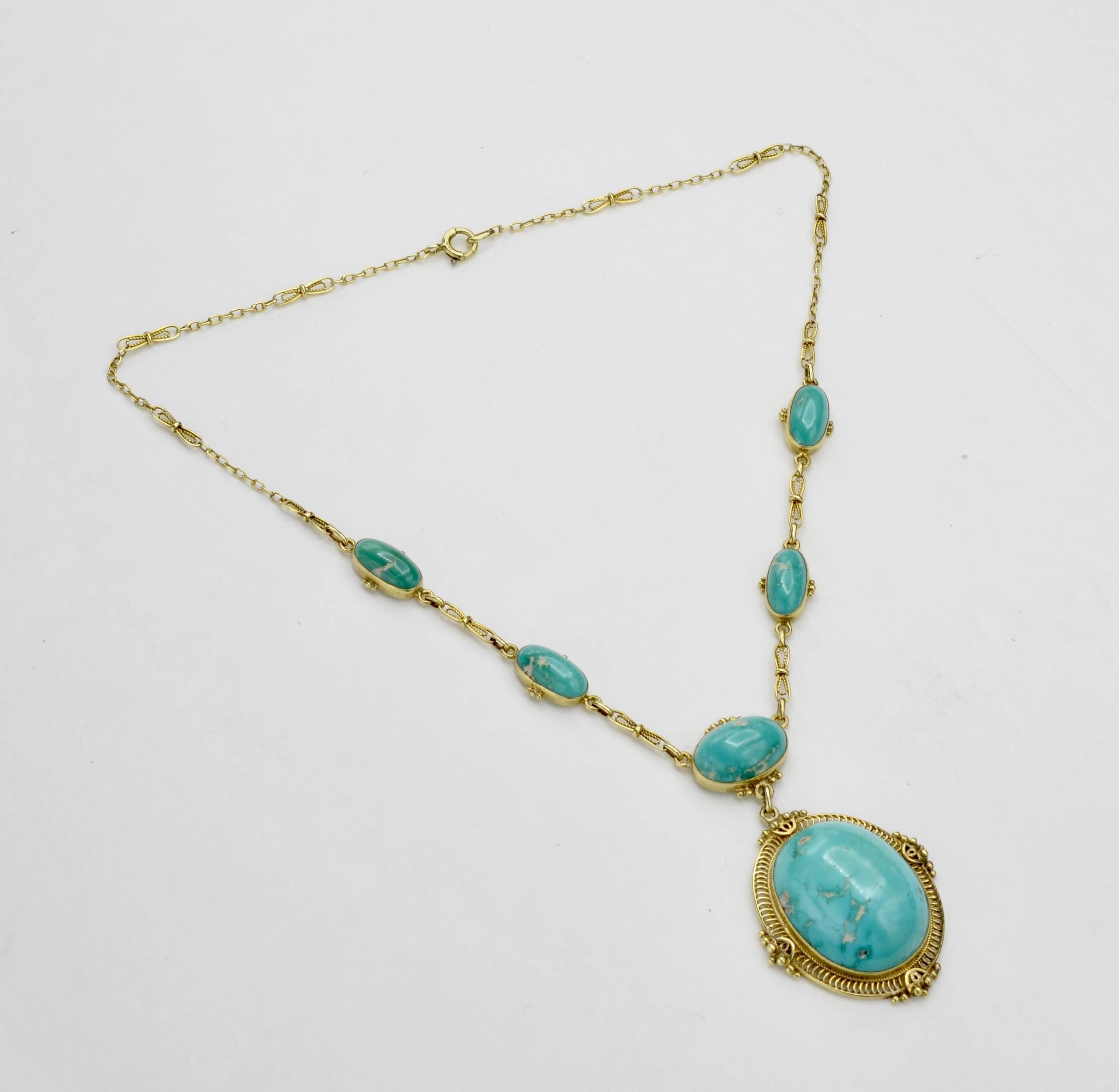 This stunning necklace has beautifully matched turquoise in the warmest shade or green/blue. The gold chain has an open lace design that beautifully frames the pendants and center turquoise drop for a dramatic but delicate effect. This necklace