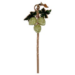 Épingle à cravate ancienne en or 14 carats et émaillée à motif de graines ou de fleurs de housse