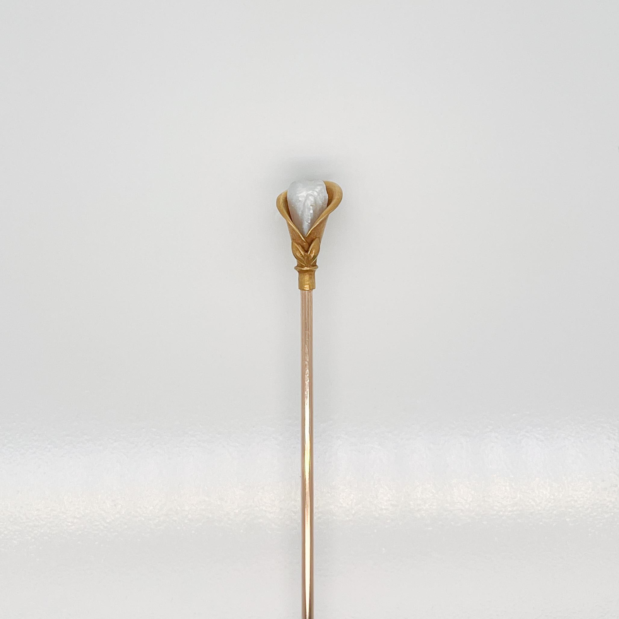 A very fine 14k gold (and gold filled) Peace Lily hat pin (or stickpin / lapel pin) with a pearl.

With a 14K gold figural Peace Lily top with Keshi pearl set in center and mounted on a gold filled pin shaft.

Simply a wonderful hat pin or