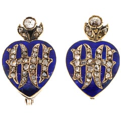 Boucles d'oreilles anciennes en or 14 carats, émail bleu, rosace et diamant.