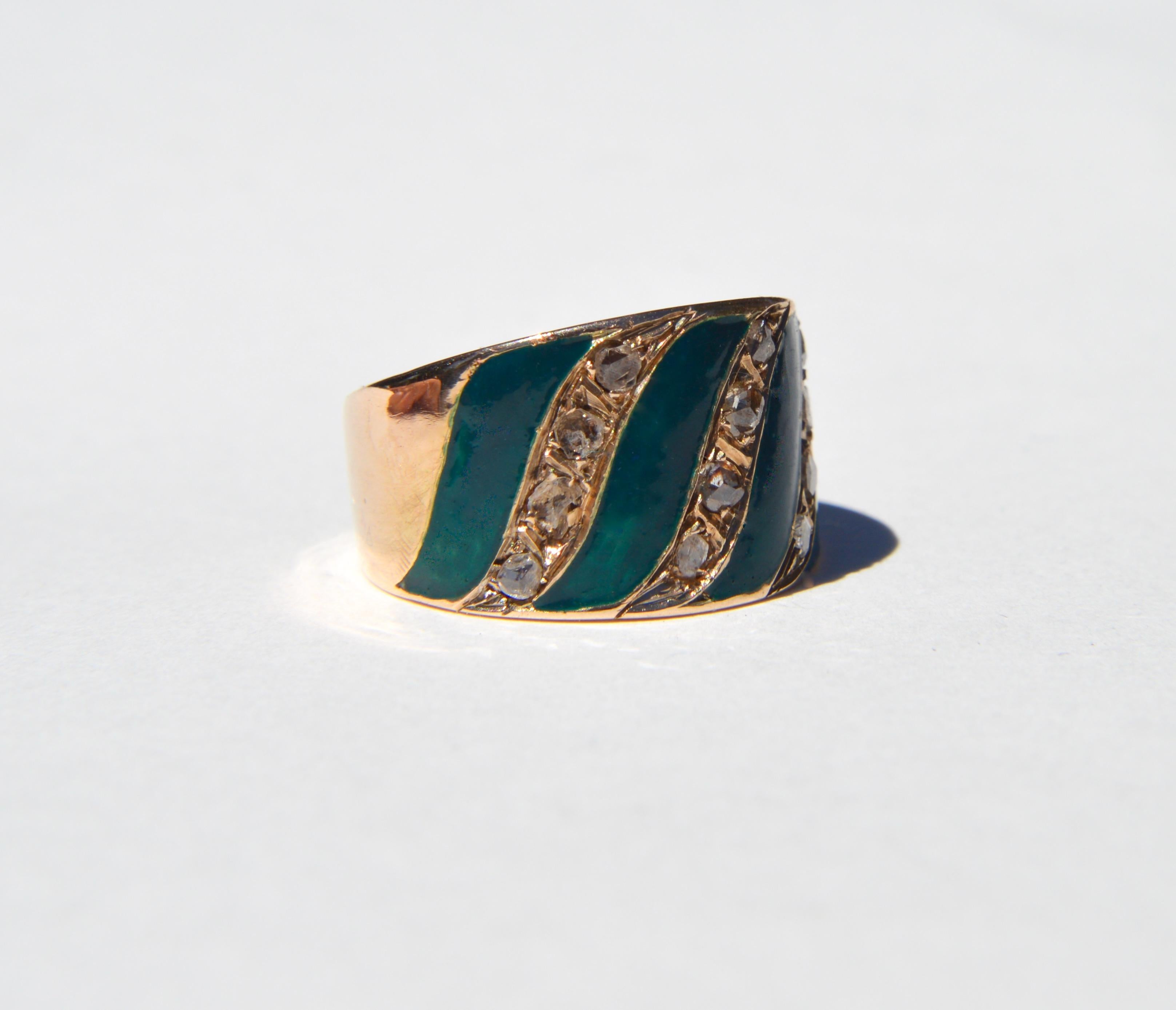 Beautiful and unique antique Edwardian era circa 1900-1905 14K rose gold cigar band style ring. Total of 12 sparkling rosecut diamonds with deep forest green enamel work. Marked as 14K gold. In very good condition. Size 9, can be resized by a